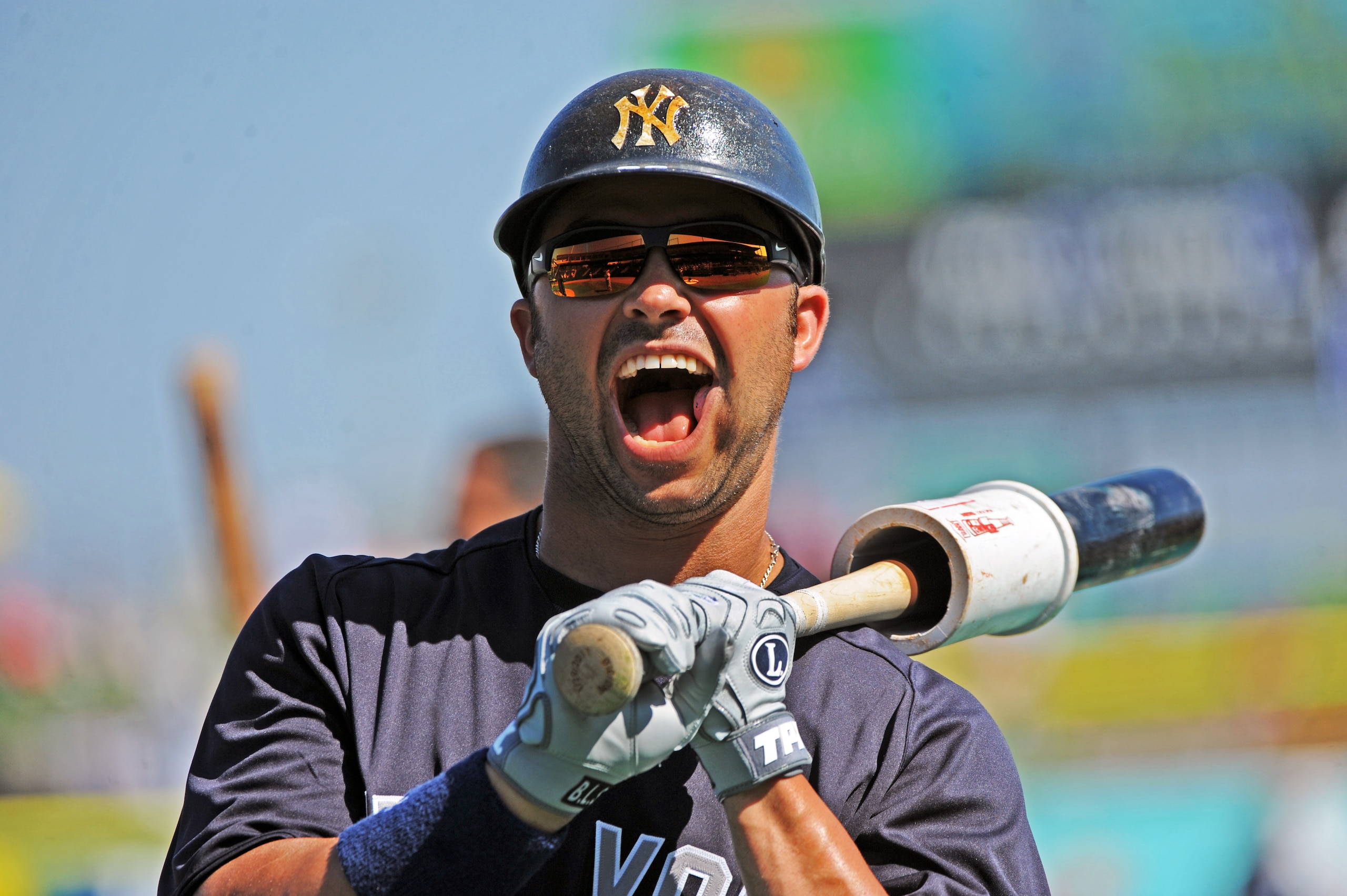 CLEARWATER, FL - FEBRUARY 27:  Outfielder Nick Swisher #33 of the New York Yankees talks with fans during batting practice against the Philadelphia Phillies February 27, 2011 at Bright House Field in Clearwater, Florida.  (Photo by Al Messerschmidt/Getty