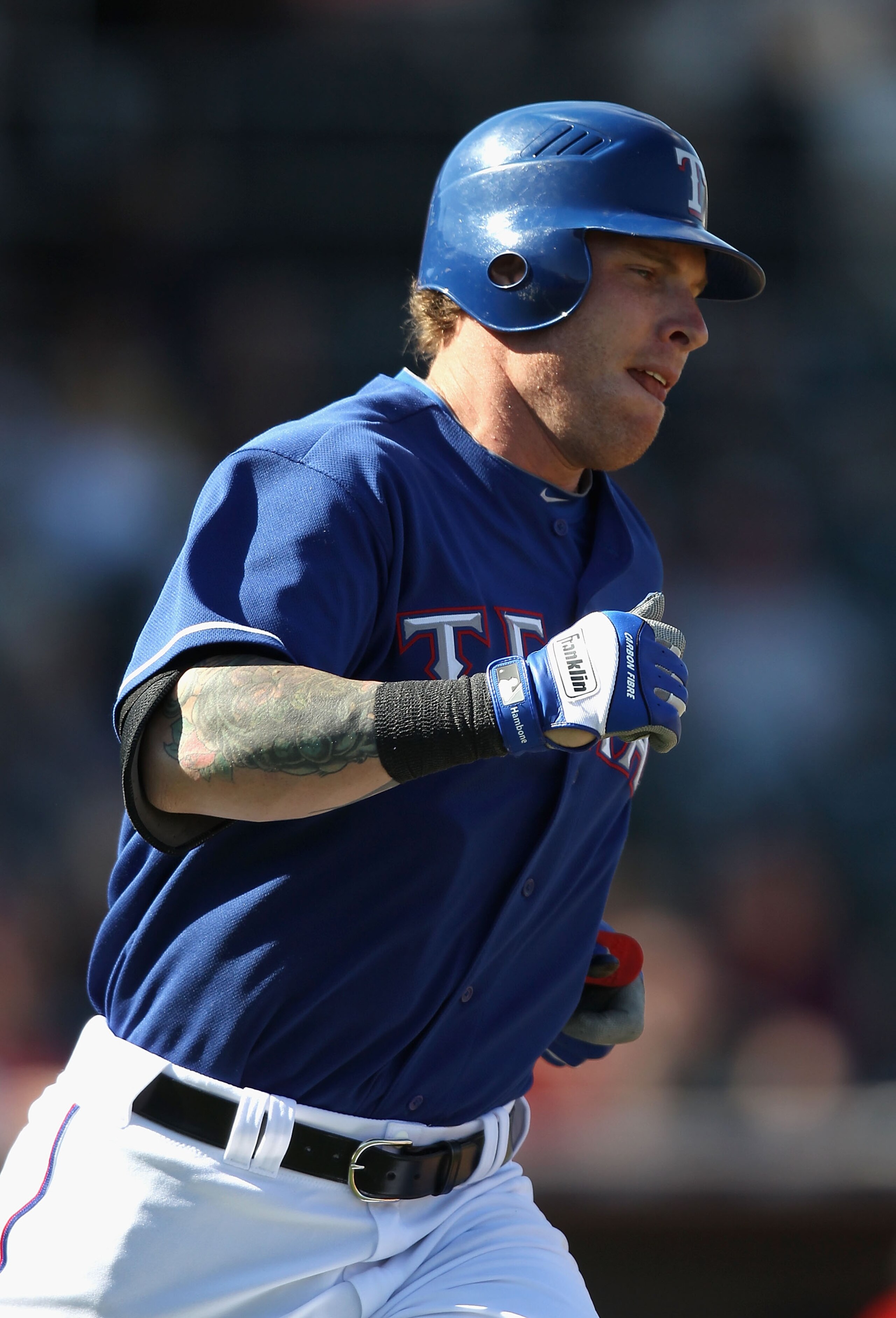 SURPRISE, AZ - MARCH 02:  Josh Hamilton #32 of the Texas Rangers runs to first base during the spring training game against the Los Angeles Angels of Anaheim at Surprise Stadium on March 2, 2011 in Surprise, Arizona.  (Photo by Christian Petersen/Getty Im