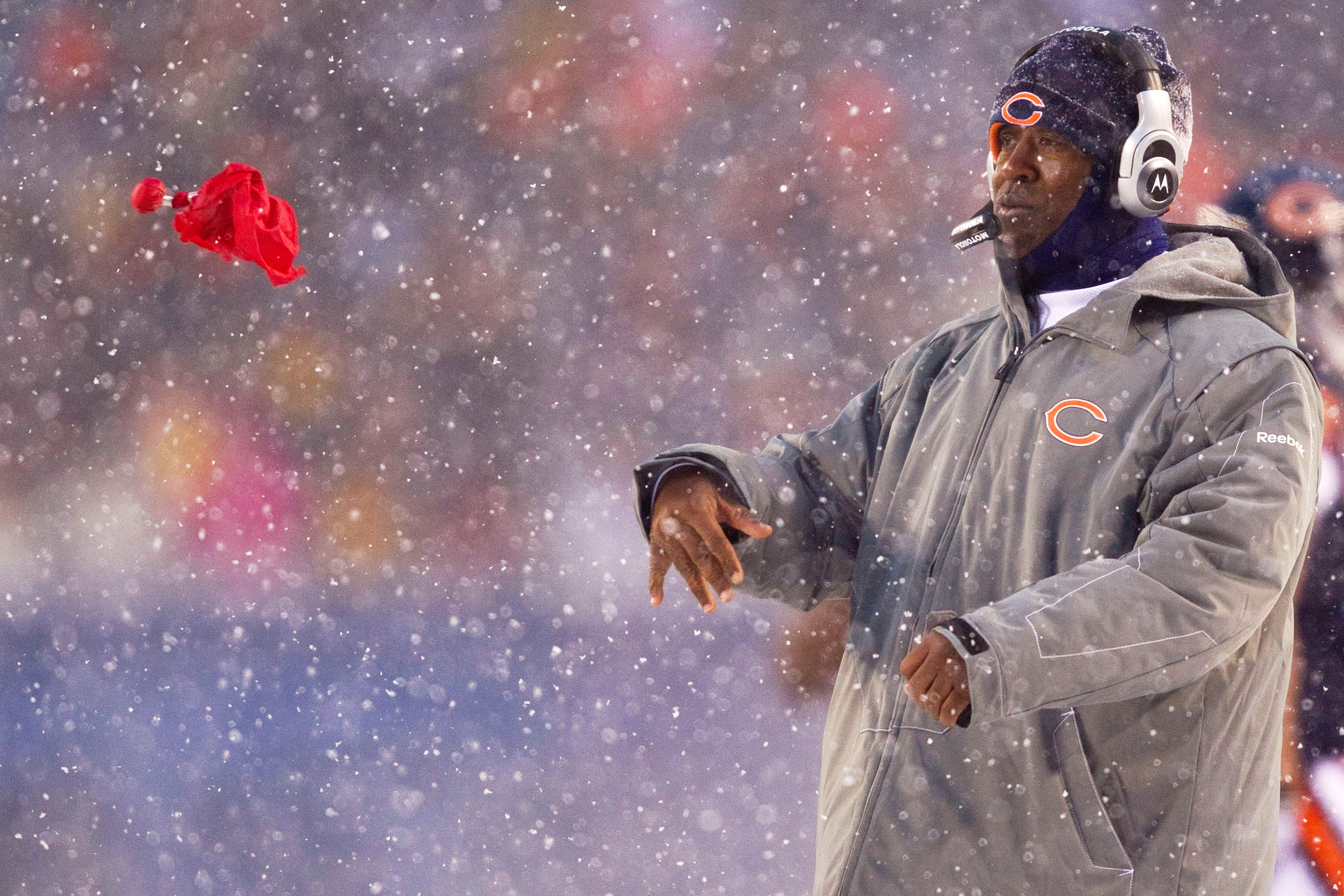 CHICAGO, IL - DECEMBER 12: Head coach Lovie Smith of the Chicago Bears throws his red flag to challenge an official's call against the New England Patriots at Soldier Field on December 12, 2010 in Chicago, Illinois.  The Patriots beat the Bears 36-7.  (Ph