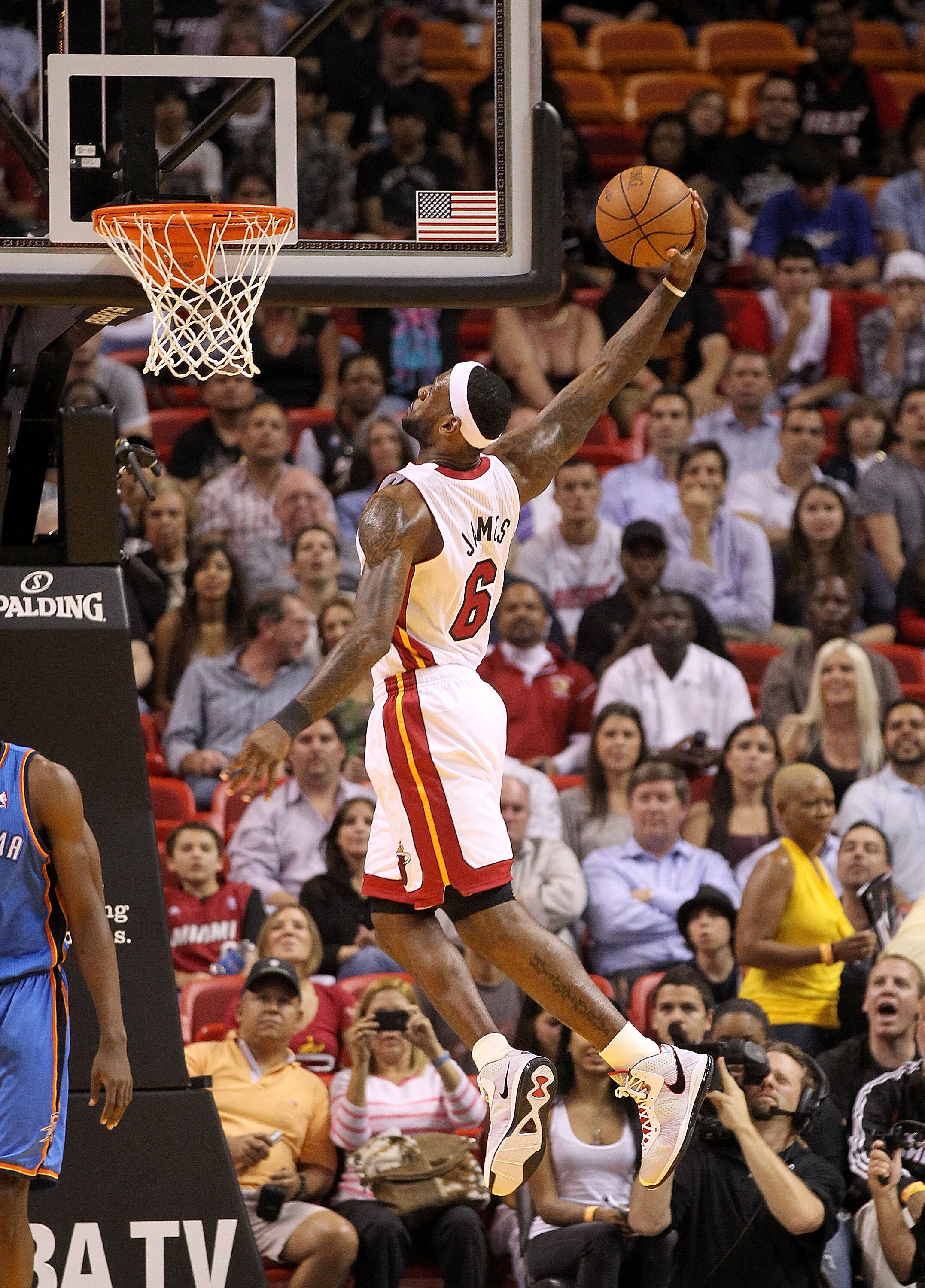 MIAMI, FL - MARCH 16: LeBron James #6 of the Miami Heat dunks during a game against the Oklahoma City Thunder at American Airlines Arena on March 16, 2011 in Miami, Florida. NOTE TO USER: User expressly acknowledges and agrees that, by downloading and/or