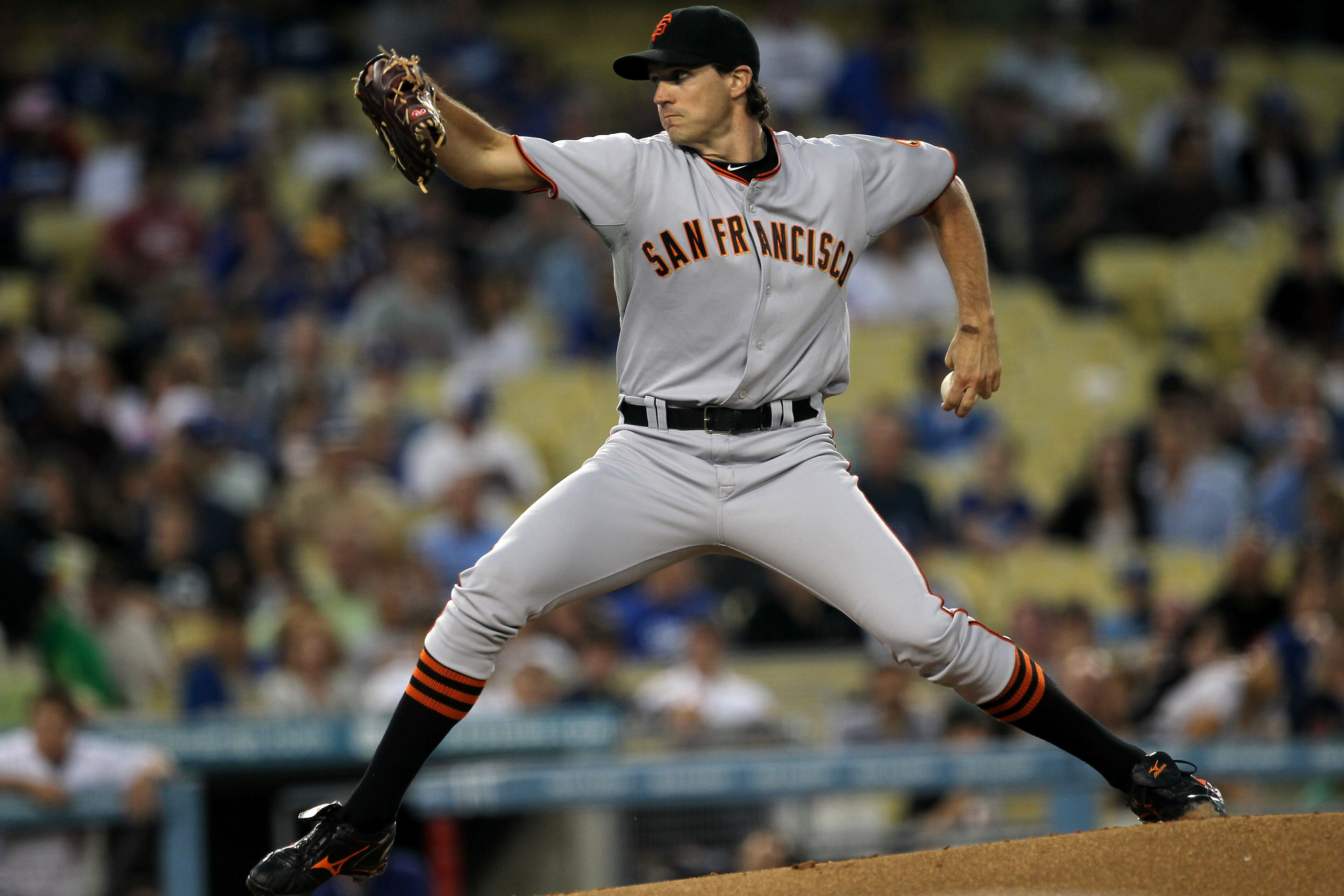 New York Mets pitcher John Maine watches the Colorado Rockies take