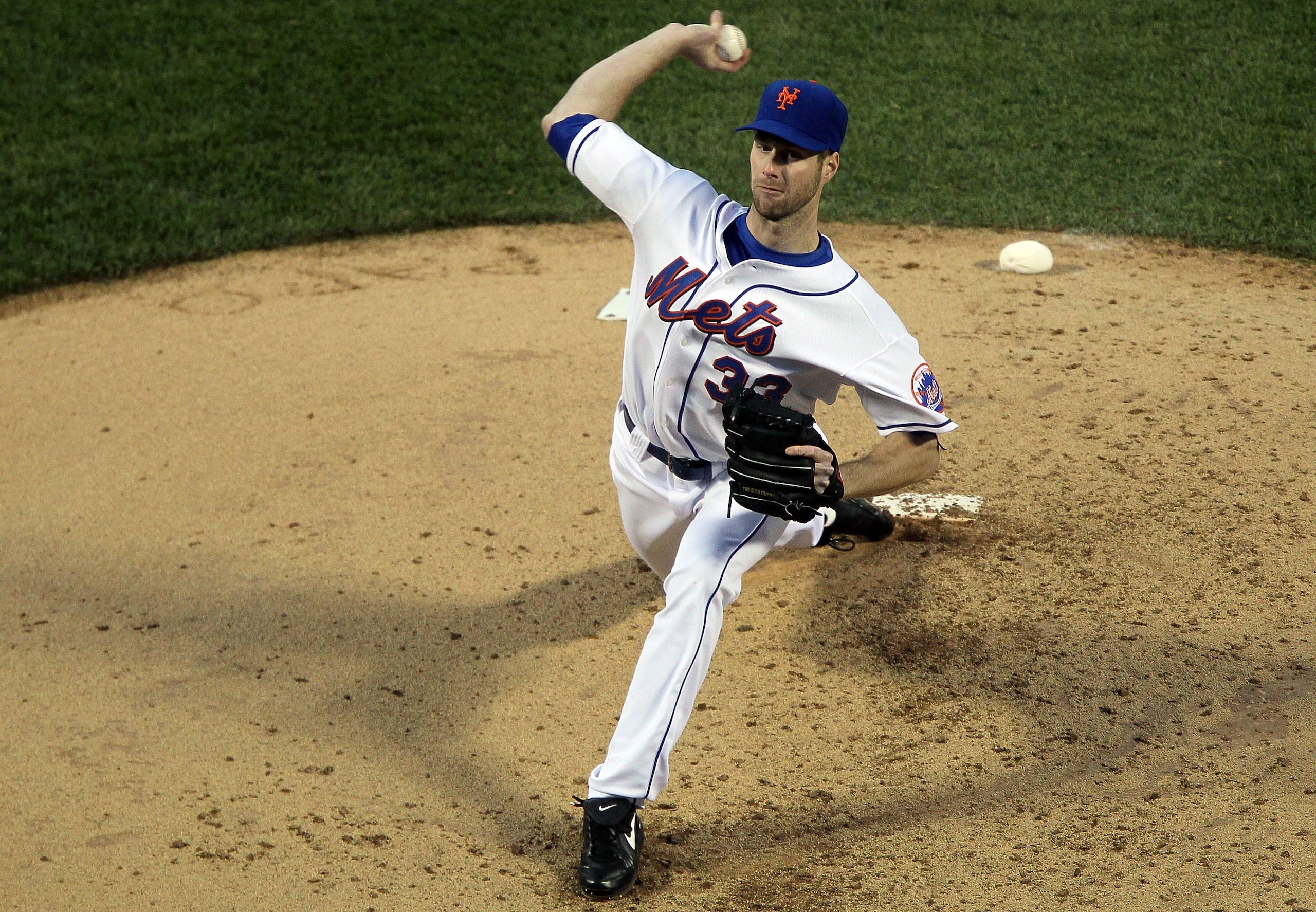 NEW YORK - MAY 10:  John Maine #33 of the New York Mets delivers a pitch against the Washington Nationals on May 10, 2010 at Citi Field in the Flushing neighborhood of the Queens borough of New York City.  (Photo by Jim McIsaac/Getty Images)