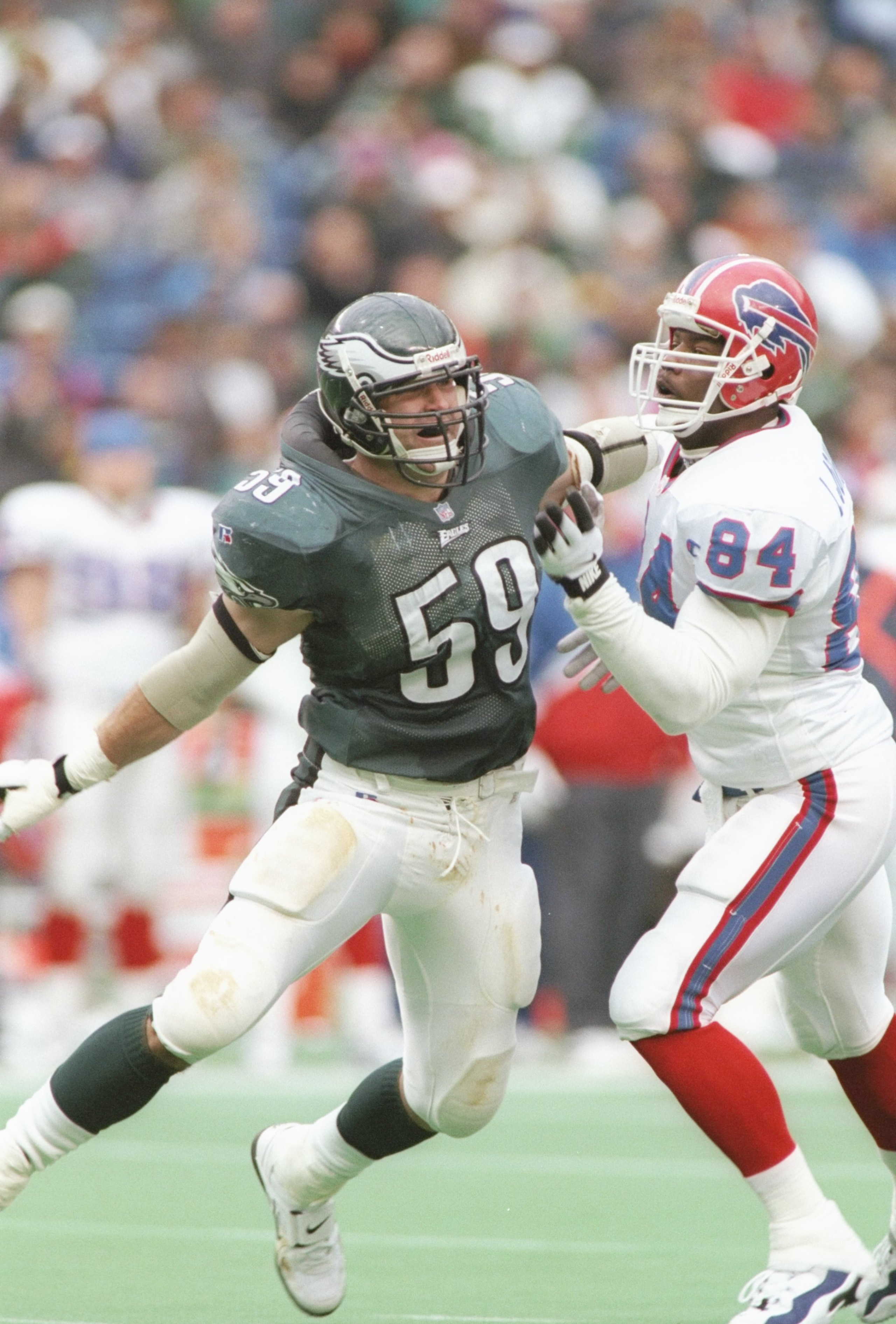 17 Nov 1996: Linebacker Mike Mamula #59 of the Philadelphia Eagles stares into the backfield as he battles with tight end Lonnie Johnson #84 of the Buffalo Bills while pursuing the football during a play in the Eagles 24-17 loss to the Bills at Veterans S