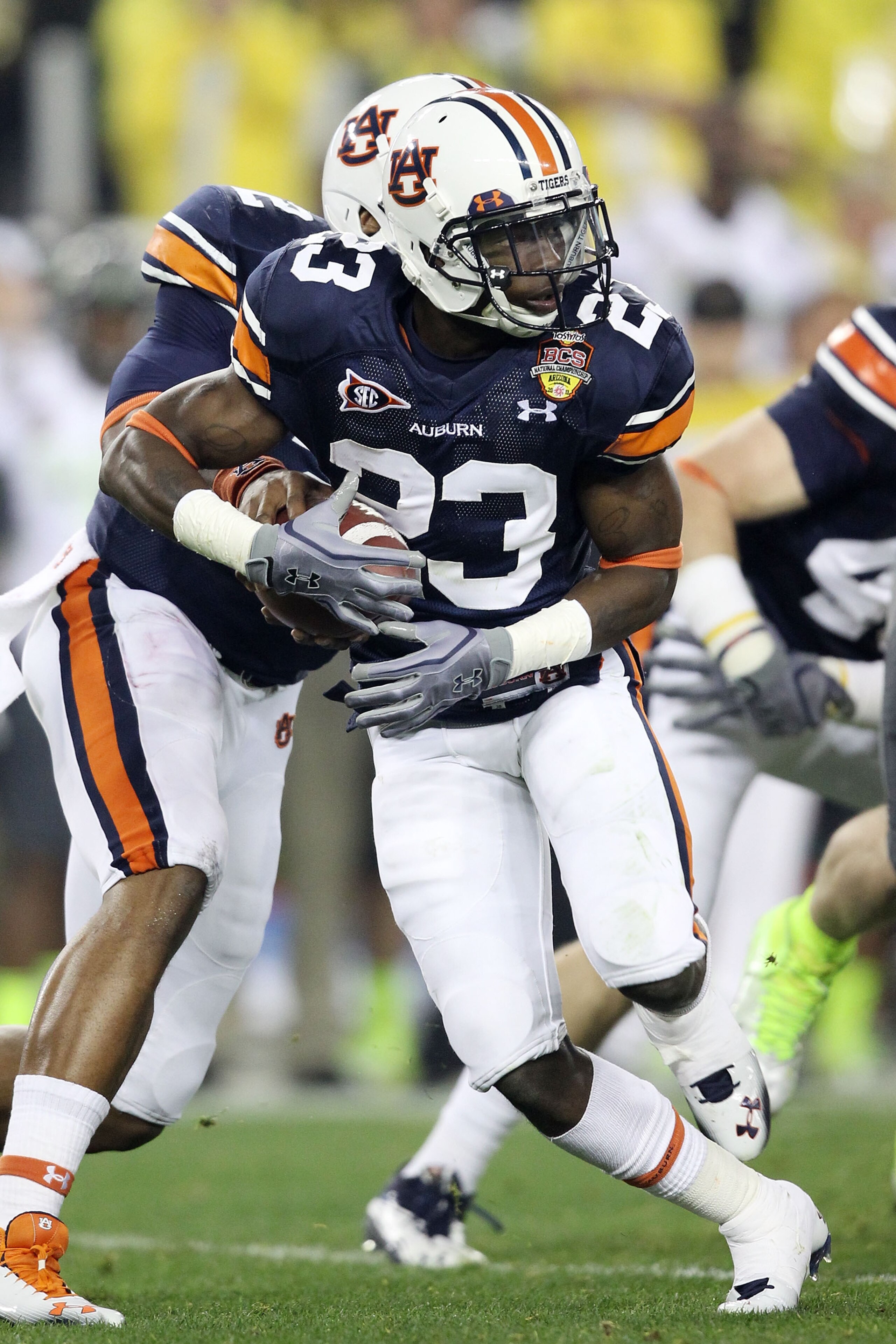 GLENDALE, AZ - JANUARY 10:  Onterio McCalebb #23 of the Auburn Tigers runs down field against the Oregon Ducks during the Tostitos BCS National Championship Game at University of Phoenix Stadium on January 10, 2011 in Glendale, Arizona.  (Photo by Christi