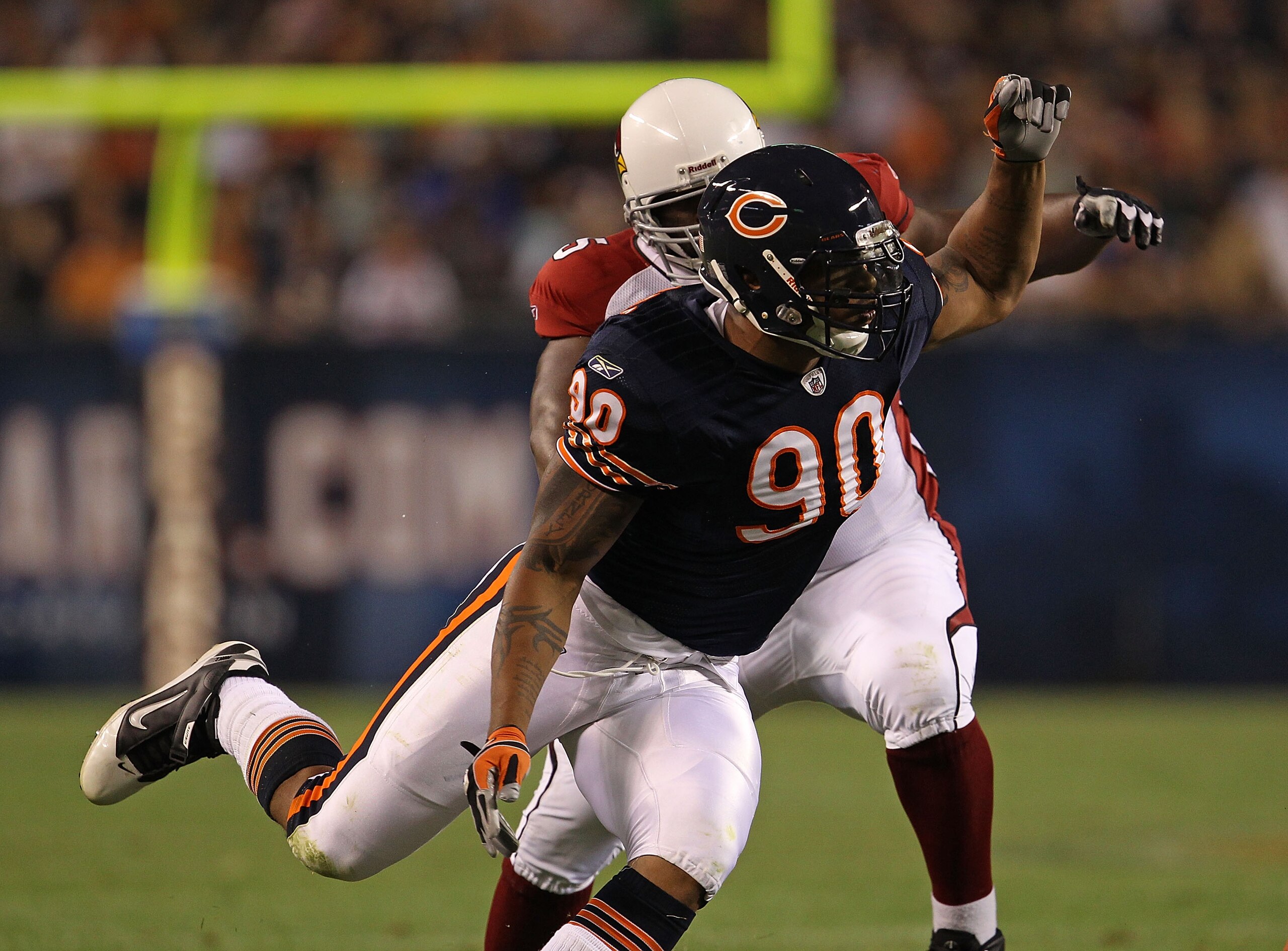 CHICAGO - AUGUST 28: Julius Peppers #90 of the Chicago Bears rushes past Levi Brown #75 of the Arizona Cardinals during a preseason game at Soldier Field on August 28, 2010 in Chicago, Illinois. (Photo by Jonathan Daniel/Getty Images)