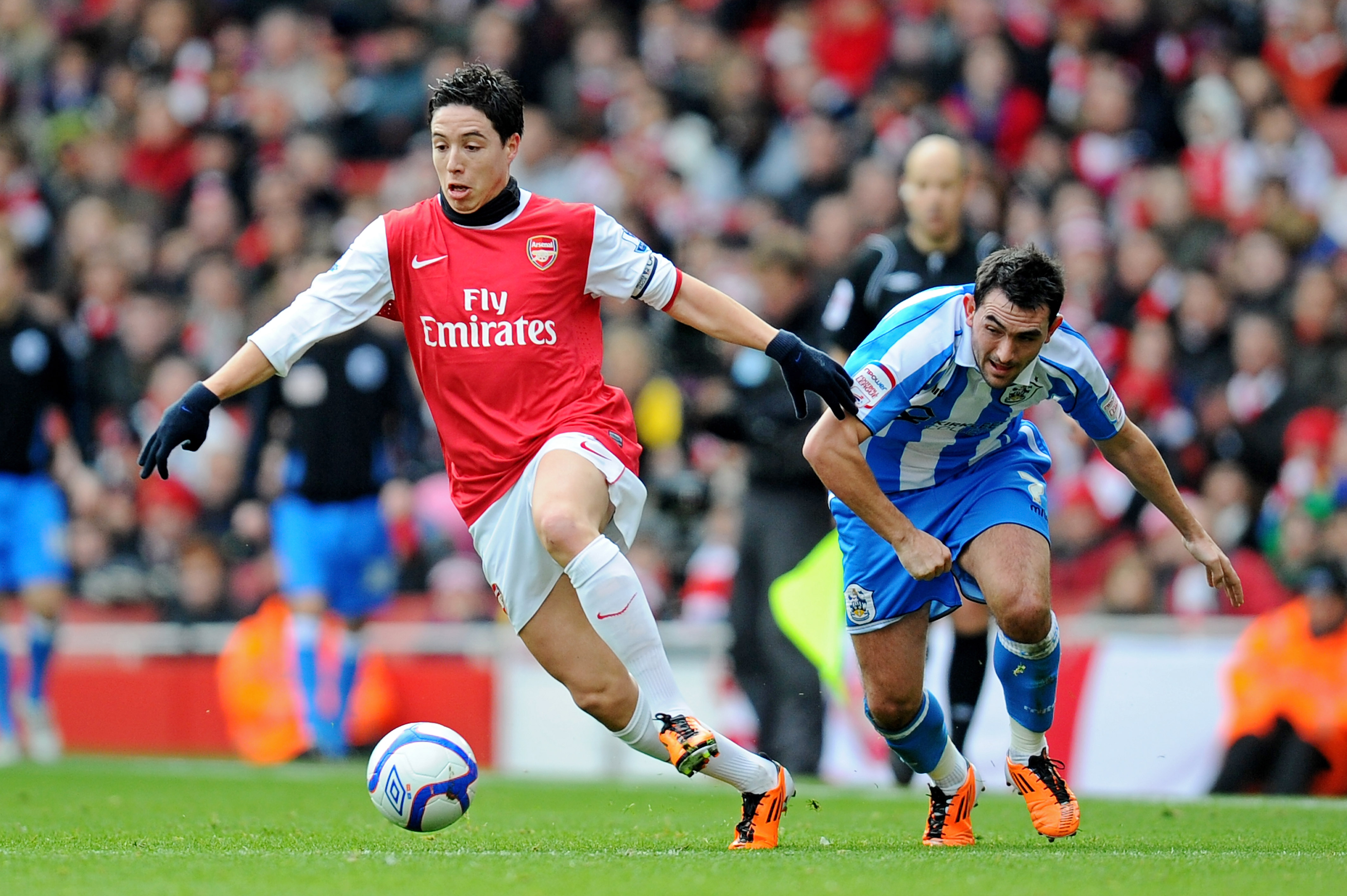 LONDON, ENGLAND - JANUARY 30:  Samir Nasri of Arsenal goes past Gary Roberts of Huddersfield during the FA Cup sponsored by E.ON fourth round match between Arsenal and Huddersfield Town at The Emirates Stadium on January 30, 2011 in London, England.  (Pho