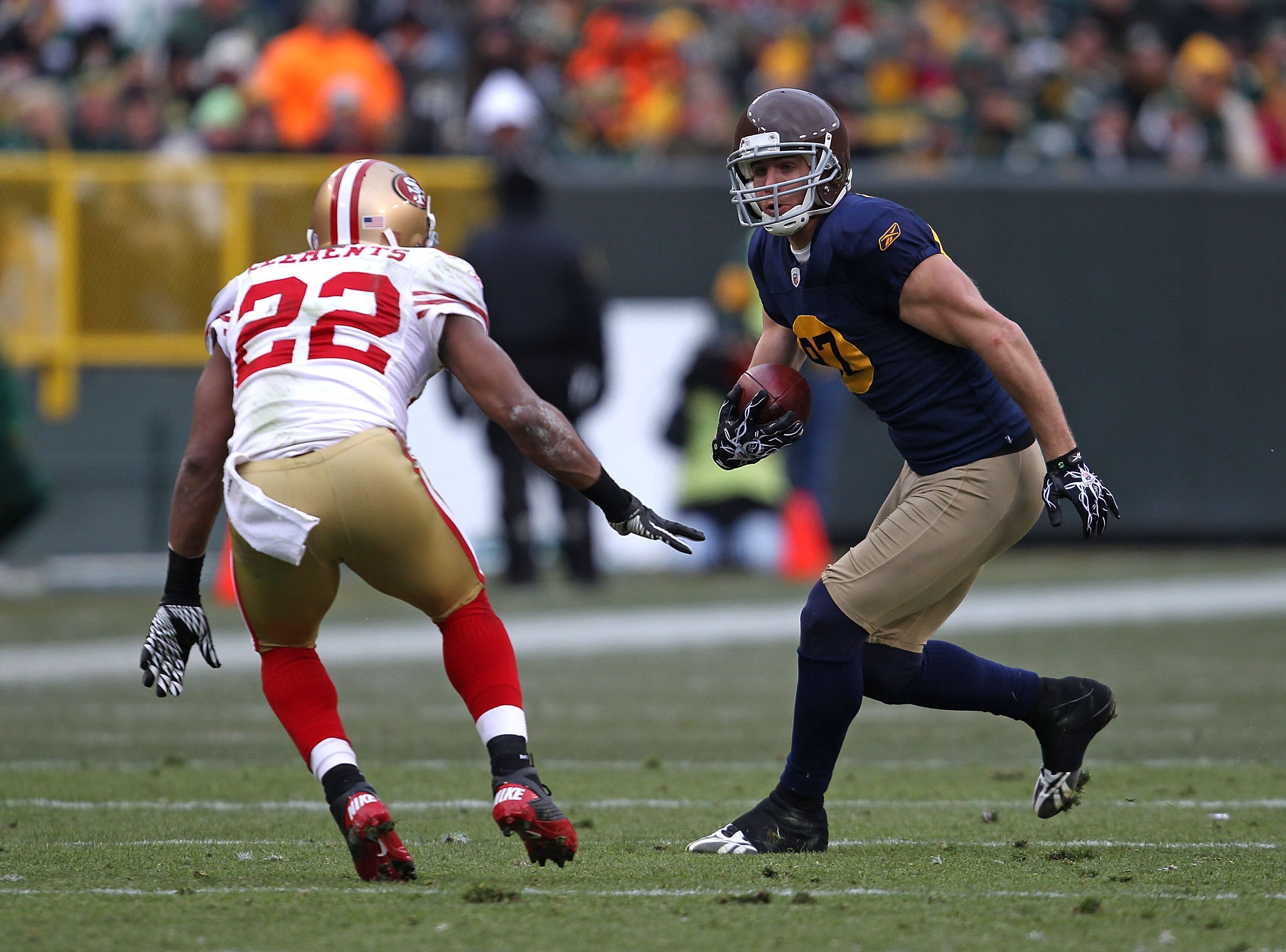 GREEN BAY, WI - DECEMBER 05: Jordy Nelson #87 of the Green Bay Packers moves against Nate Clements #22 of the San Francisco 49ers after catching a pass  at Lambeau Field on December 5, 2010 in Green Bay, Wisconsin. The Packers defeated the 49ers 34-16. (P