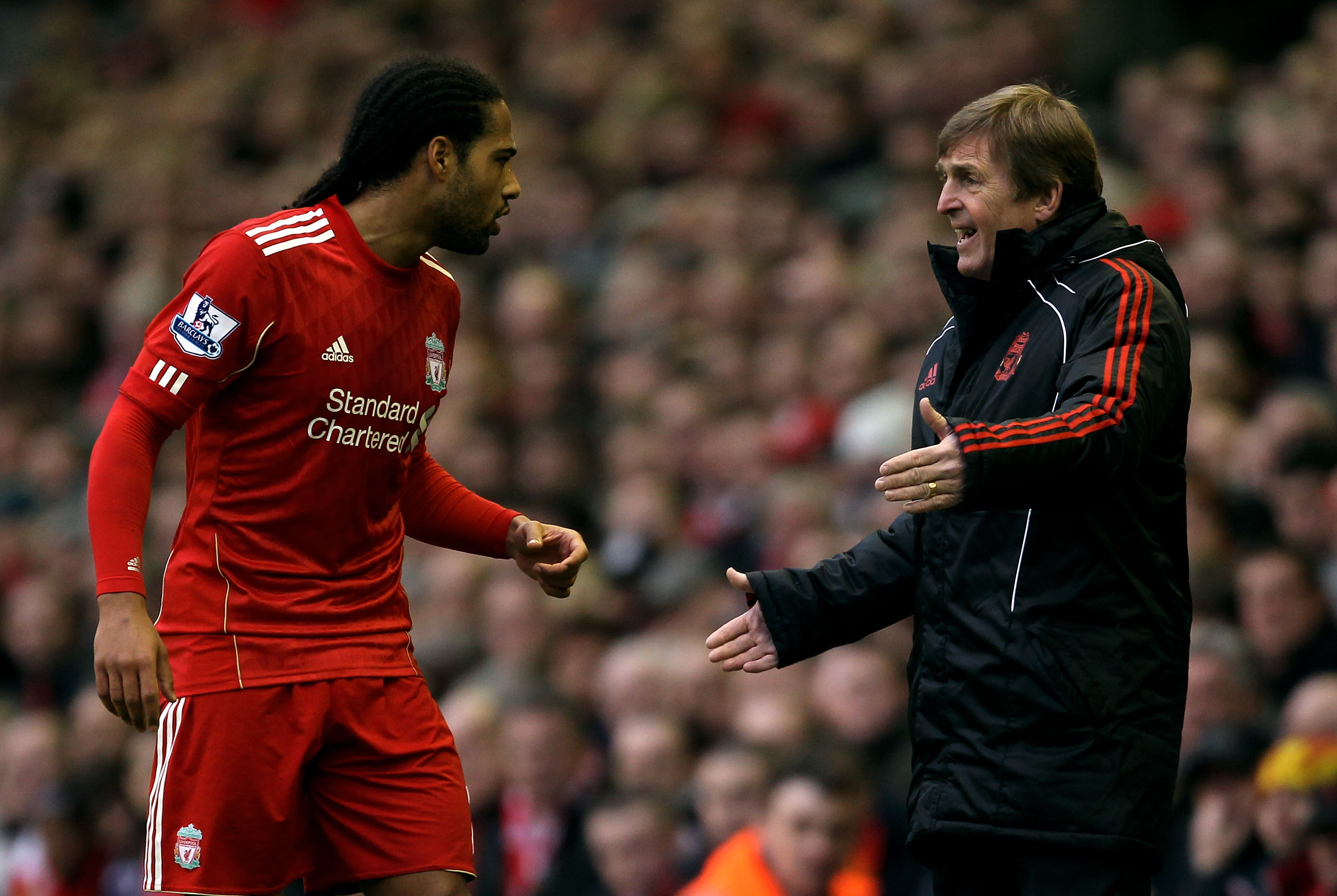 LIVERPOOL, ENGLAND - JANUARY 16:  Liverpool Manager Kenny Dalglish issues instructions to Glen Johnson during the Barclays Premier League match between Liverpool and Everton at Anfield on January 16, 2011 in Liverpool, England.  (Photo by Alex Livesey/Get
