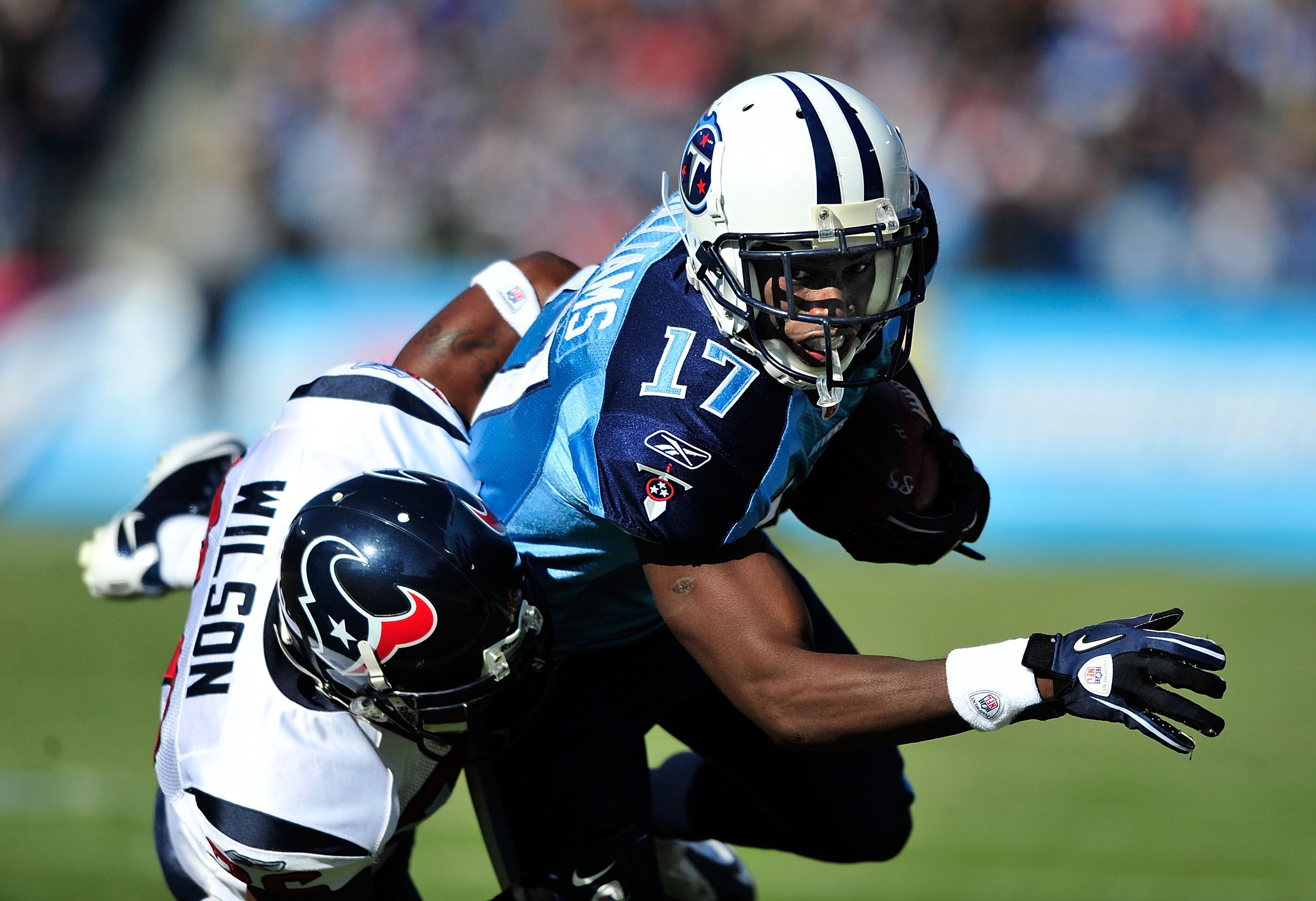 NASHVILLE, TN - DECEMBER 19:  Damian Williams #17 of the Tennessee Titans makes a catch as Eugene Wilson #26 of the Houston Texans defends during the first half at LP Field on December 19, 2010 in Nashville, Tennessee.  (Photo by Grant Halverson/Getty Ima