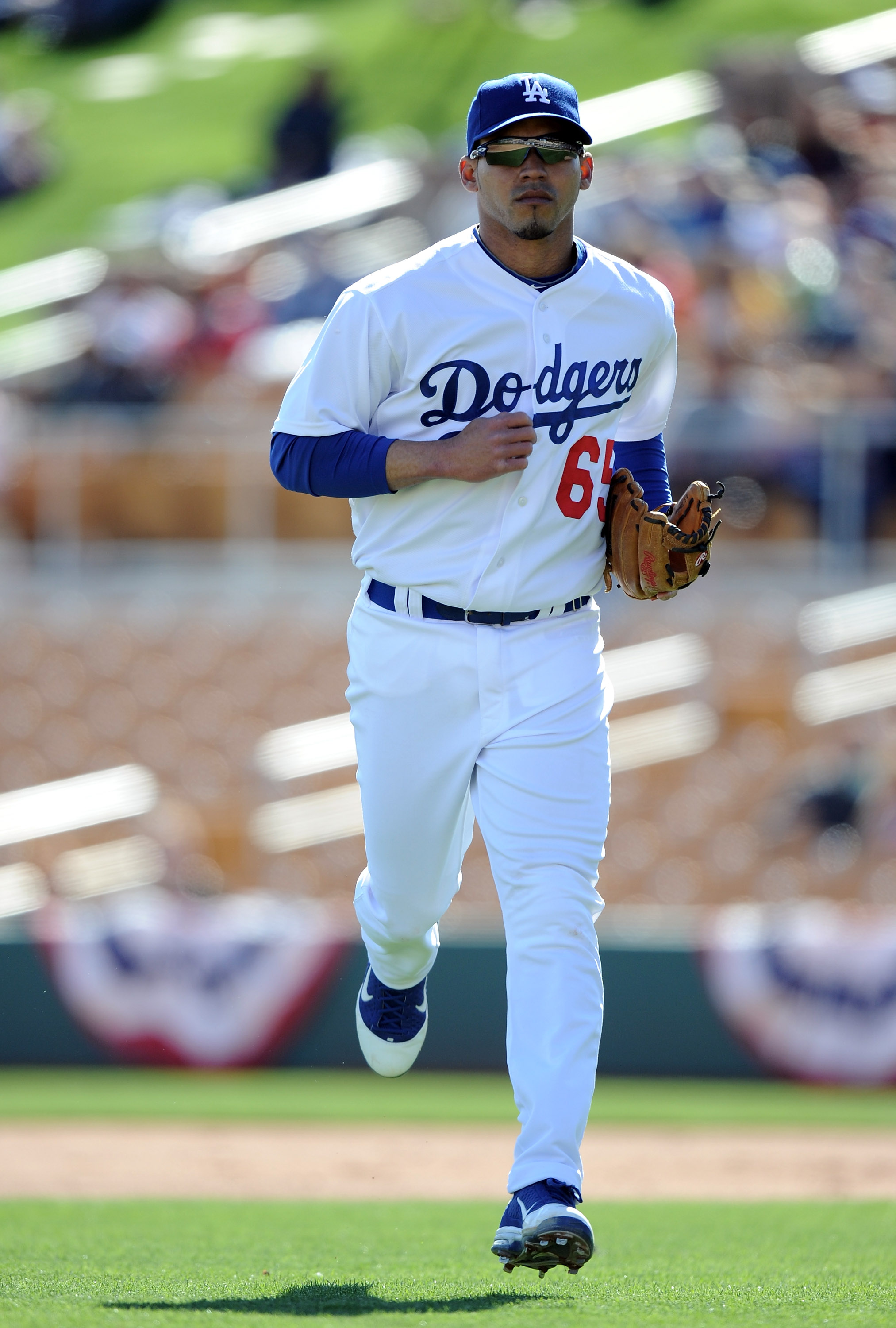 PHOENIX, AZ - FEBRUARY 27:  Ivan De Jesus #65 of the Los Angeles Dodgers leaves the field during spring training at Camelback Ranch on February 27, 2011 in Phoenix, Arizona.  (Photo by Harry How/Getty Images)