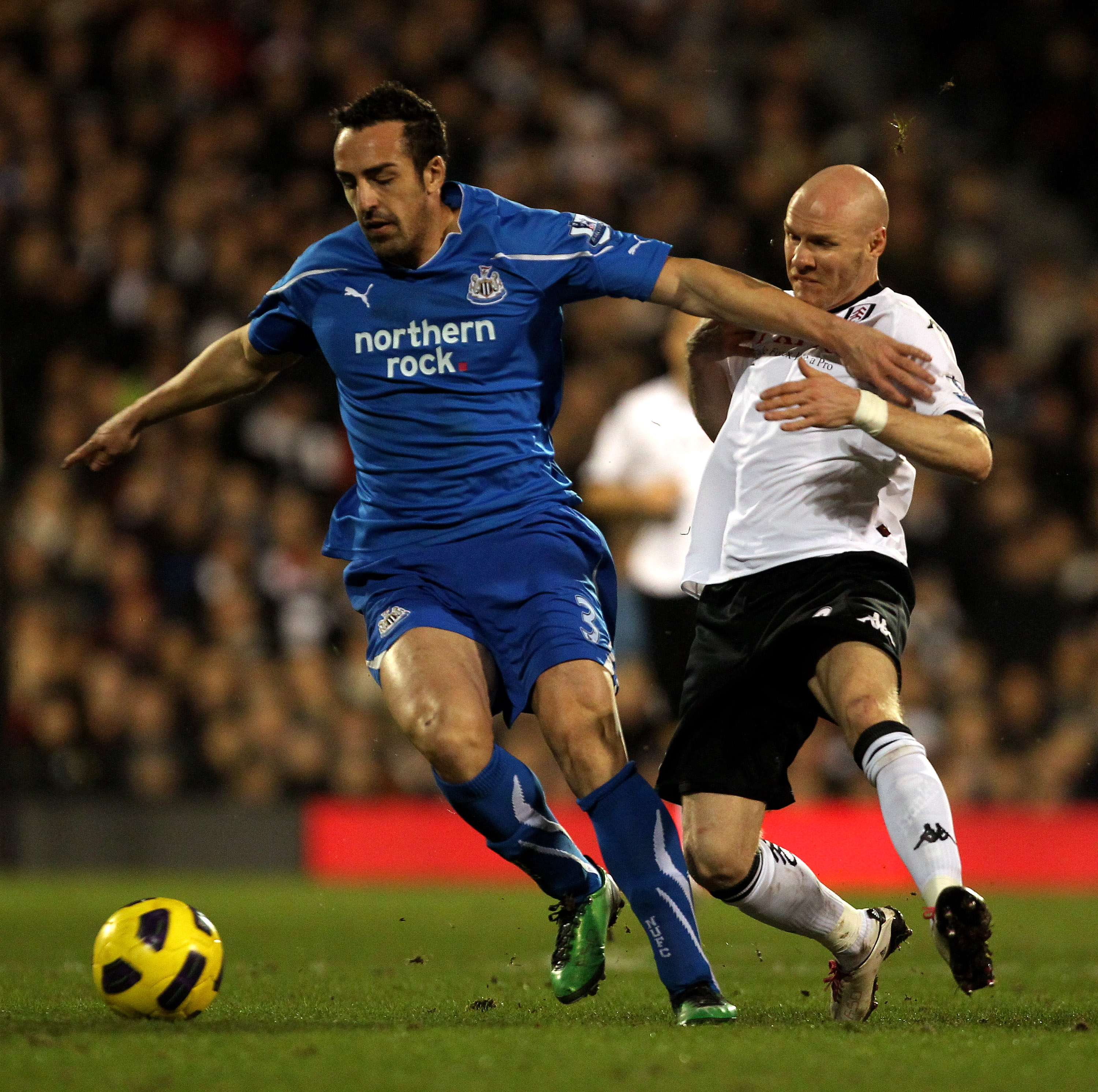 LONDON, ENGLAND - FEBRUARY 02:  Jose Enrique Sanchez (L) of Newcastle battles with Andrew Johnson of Fulham during the Barclays Premier League match between Fulham and Newcastle United at Craven Cottage on February 2, 2011 in London, England.  (Photo by C