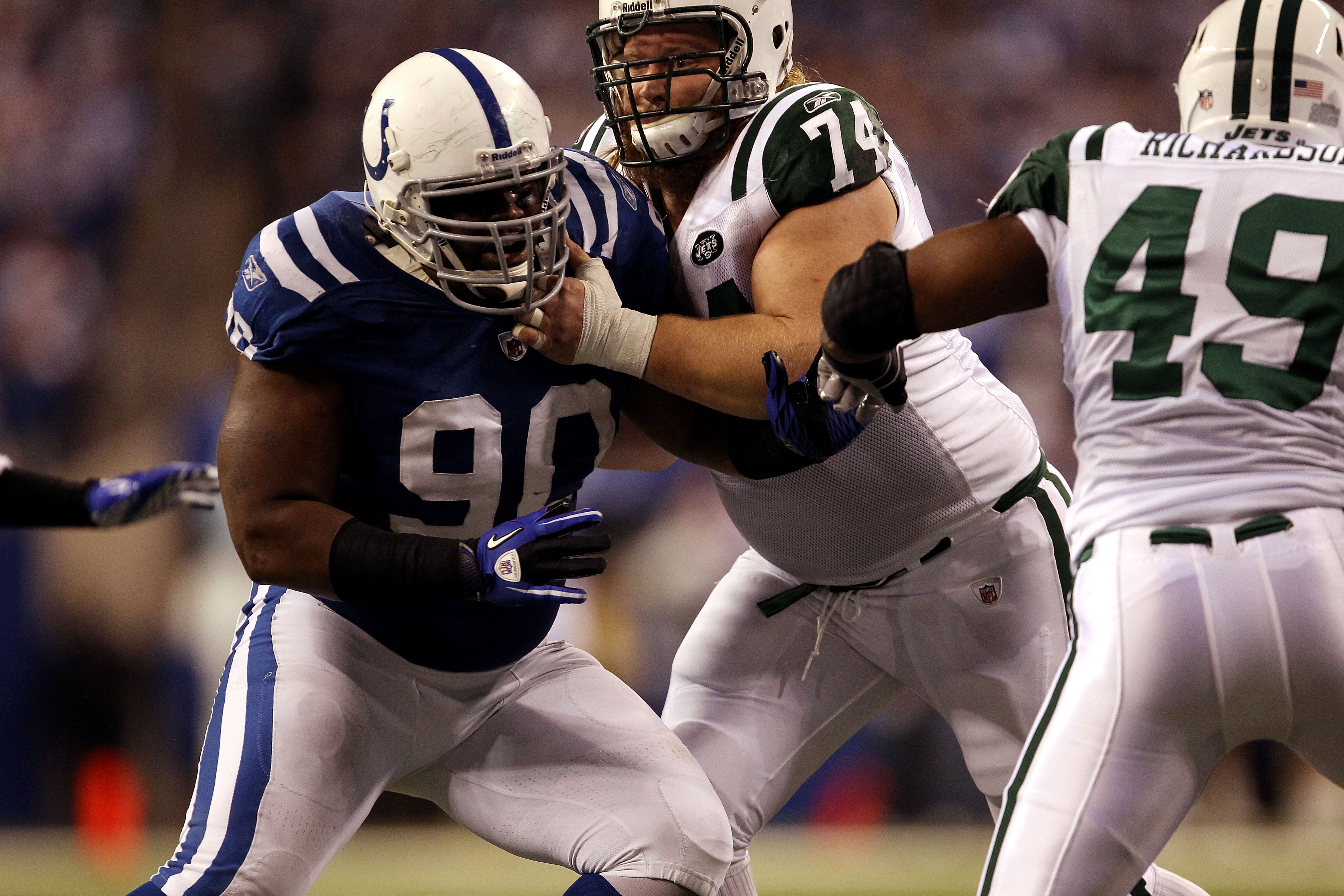 INDIANAPOLIS, IN - JANUARY 08:  Dan Muir #90 of the Indianapolis Colts defends against the New York Jets during their 2011 AFC wild card playoff game at Lucas Oil Stadium on January 8, 2011 in Indianapolis, Indiana. The Jets won 17-16.  (Photo by Jonathan