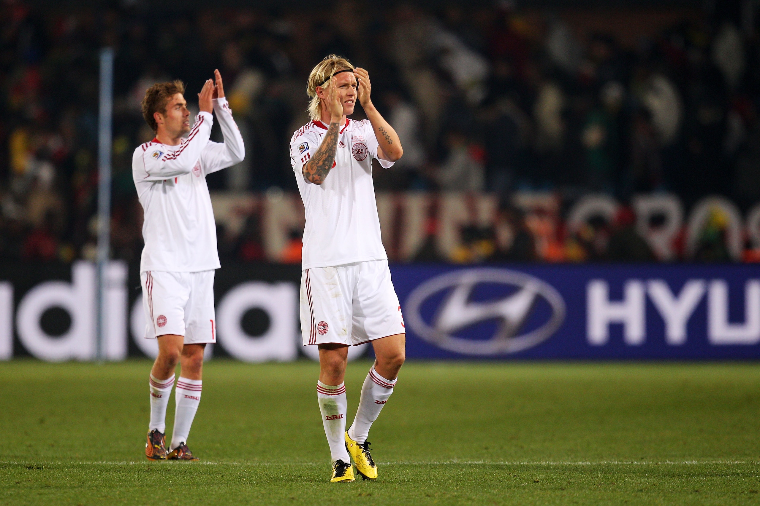 PRETORIA, SOUTH AFRICA - JUNE 19:  Jakob Poulsen and Simon Kjaer of Denmark celebrate victory in the 2010 FIFA World Cup South Africa Group E match between Cameroon and Denmark at Loftus Versfeld Stadium on June 19, 2010 in Tshwane/Pretoria, South Africa.
