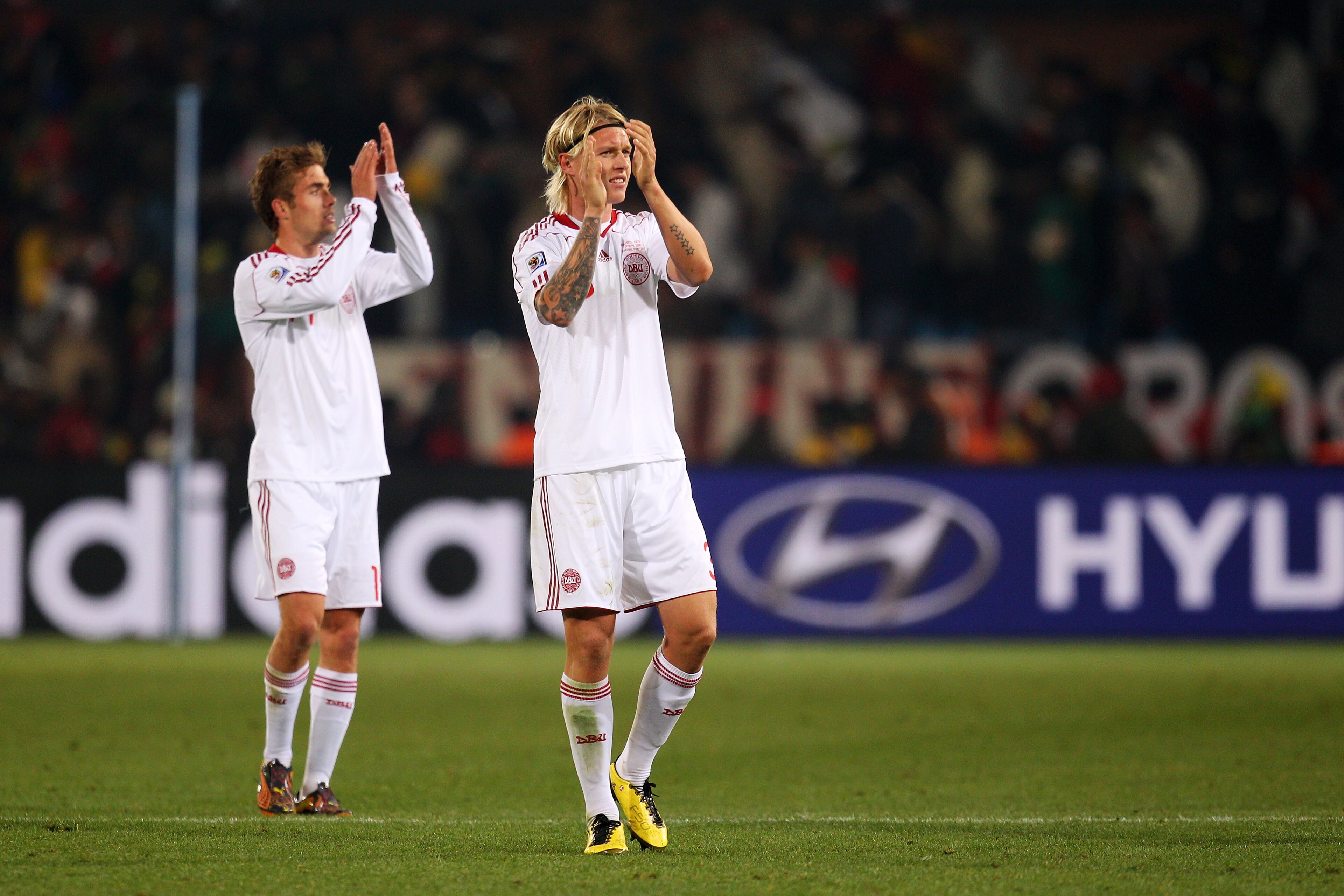 PRETORIA, SOUTH AFRICA - JUNE 19:  Jakob Poulsen and Simon Kjaer of Denmark celebrate victory in the 2010 FIFA World Cup South Africa Group E match between Cameroon and Denmark at Loftus Versfeld Stadium on June 19, 2010 in Tshwane/Pretoria, South Africa.