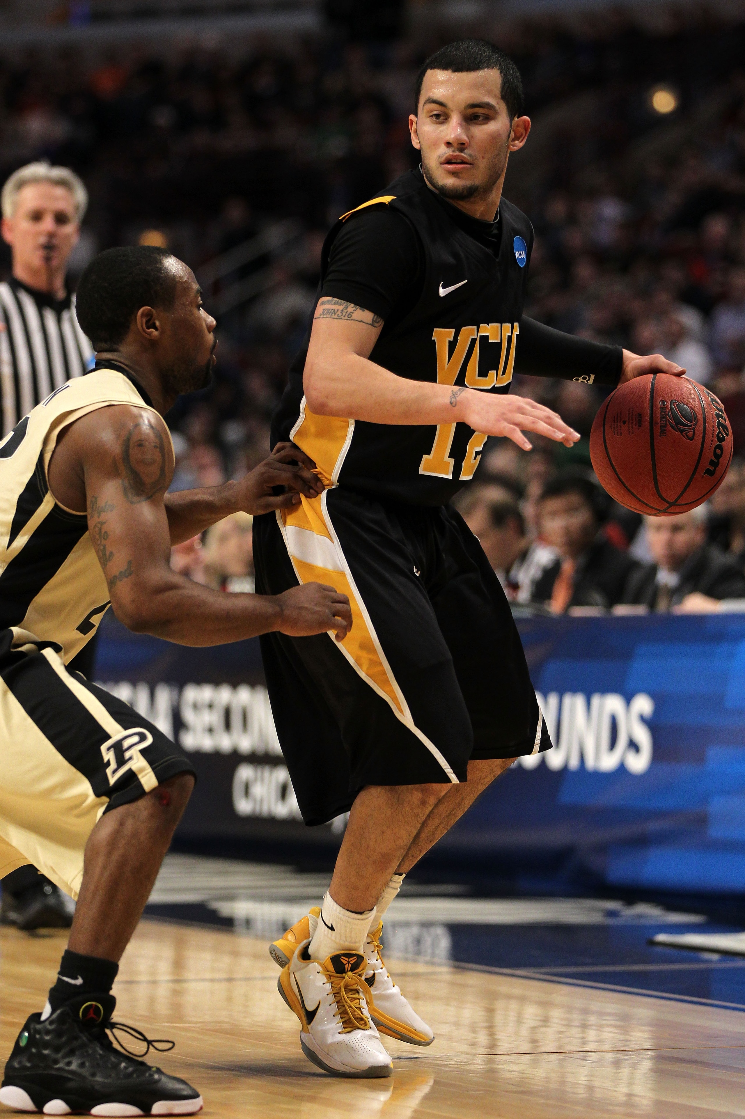 CHICAGO, IL - MARCH 20:  Joey Rodriguez #12 of the Virginia Commonwealth Rams drives against the Purdue Boilermakers in the first half during the third round of the 2011 NCAA men's basketball tournament at the United Center on March 20, 2011 in Chicago, I