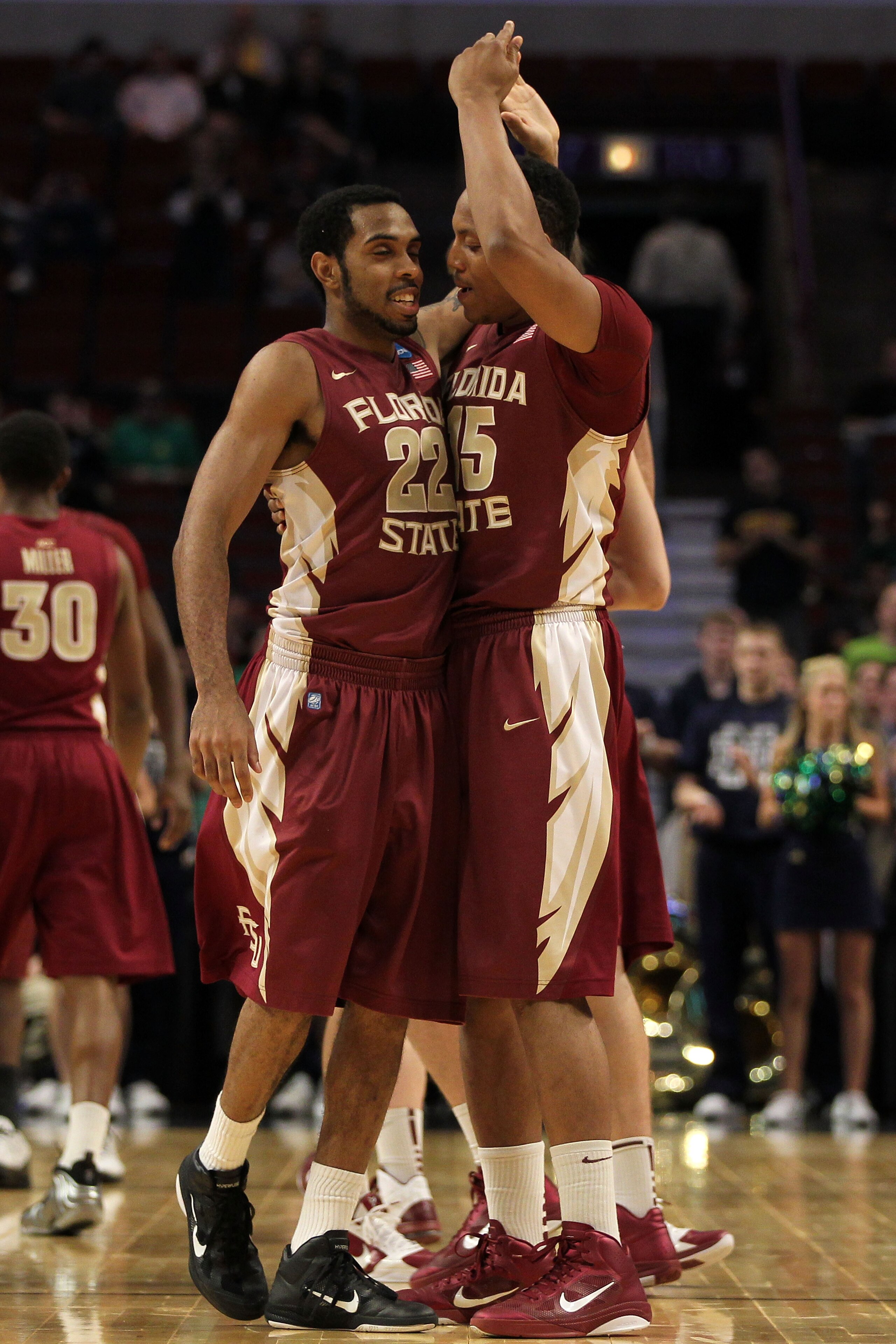 CHICAGO, IL - MARCH 20:  Derwin Kitchen #22 and Terrance Shannon #15 of the Florida State Seminoles celebrate in the second half of the game against the Notre Dame Fighting Irish during the third round of the 2011 NCAA men's basketball tournament at the U