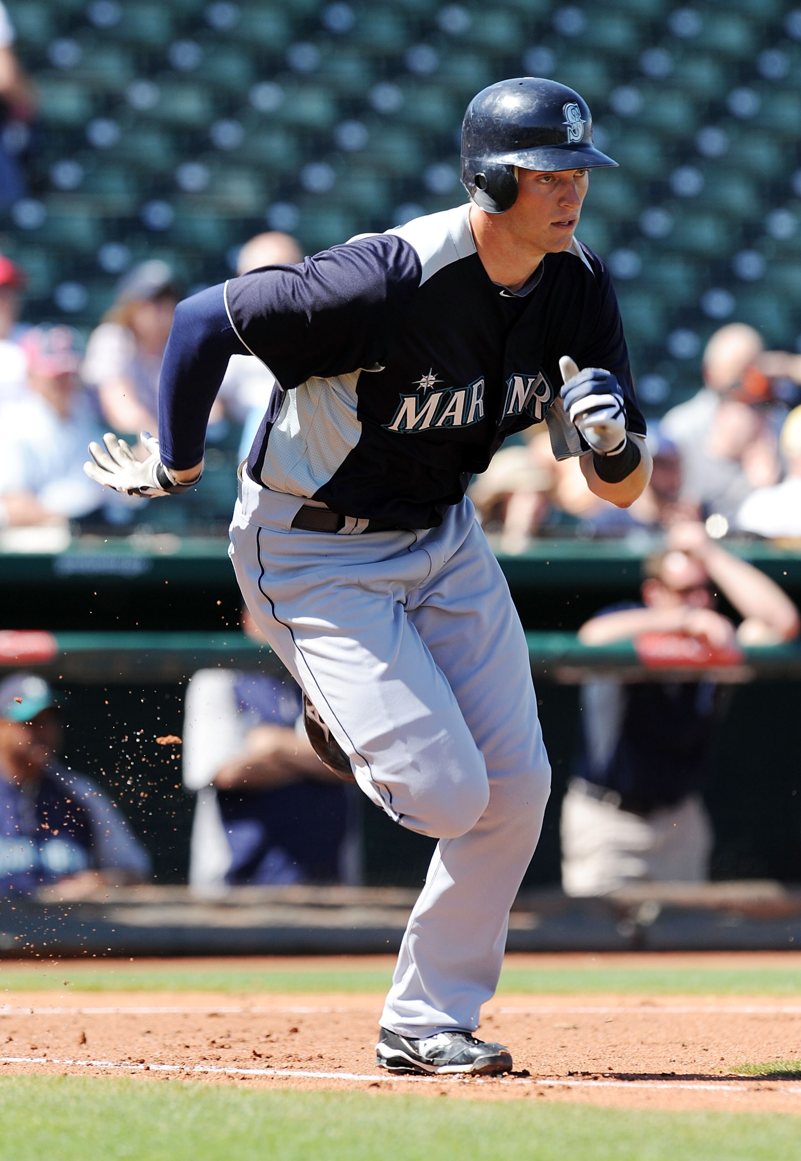 GOODYEAR, AZ - MARCH 11:  Michael Saunders #55 of the Seattle Mariners runs to first base against the Cleveland Indians at Goodyear Ballpark on March 11, 2011 in Goodyear, Arizona.  (Photo by Norm Hall/Getty Images)