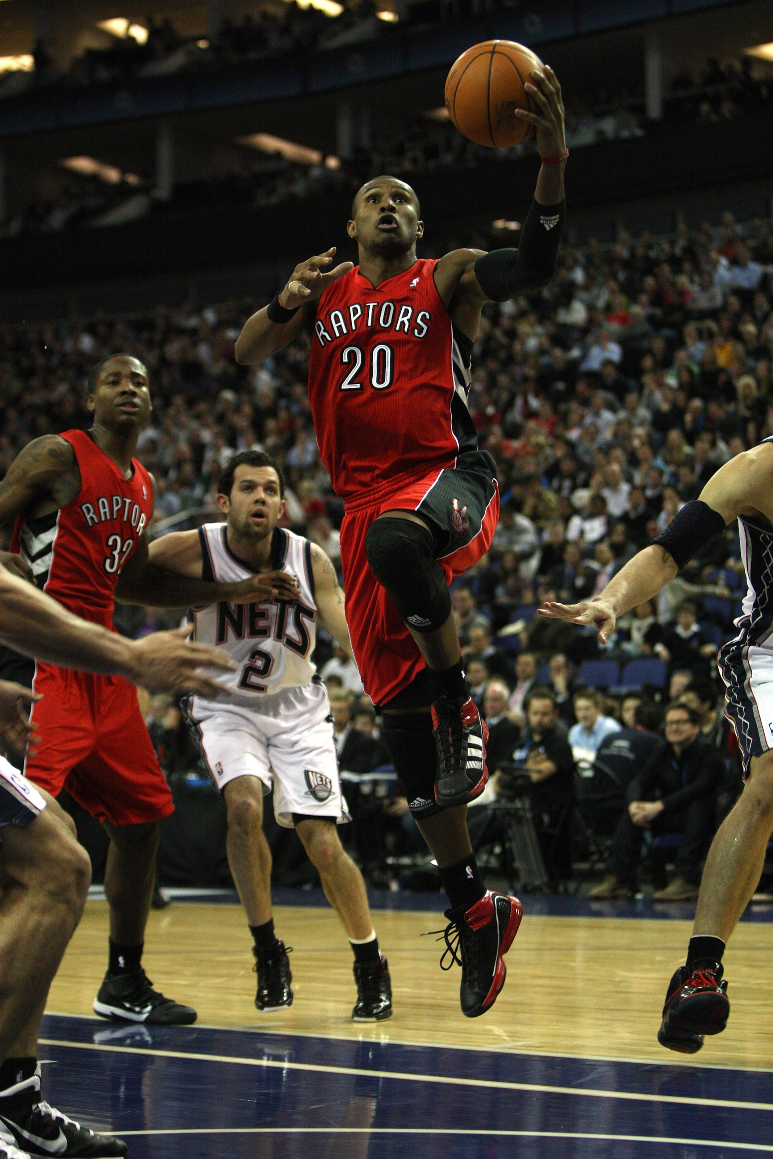 LONDON, ENGLAND - MARCH 04:  #20 Leandro Barbosa of the Raptors scores during the NBA match between New Jersey Nets and the Toronto Raptors at the O2 Arena on March 4, 2011 in London, England. NOTE TO USER: User expressly acknowledges and agrees that, by