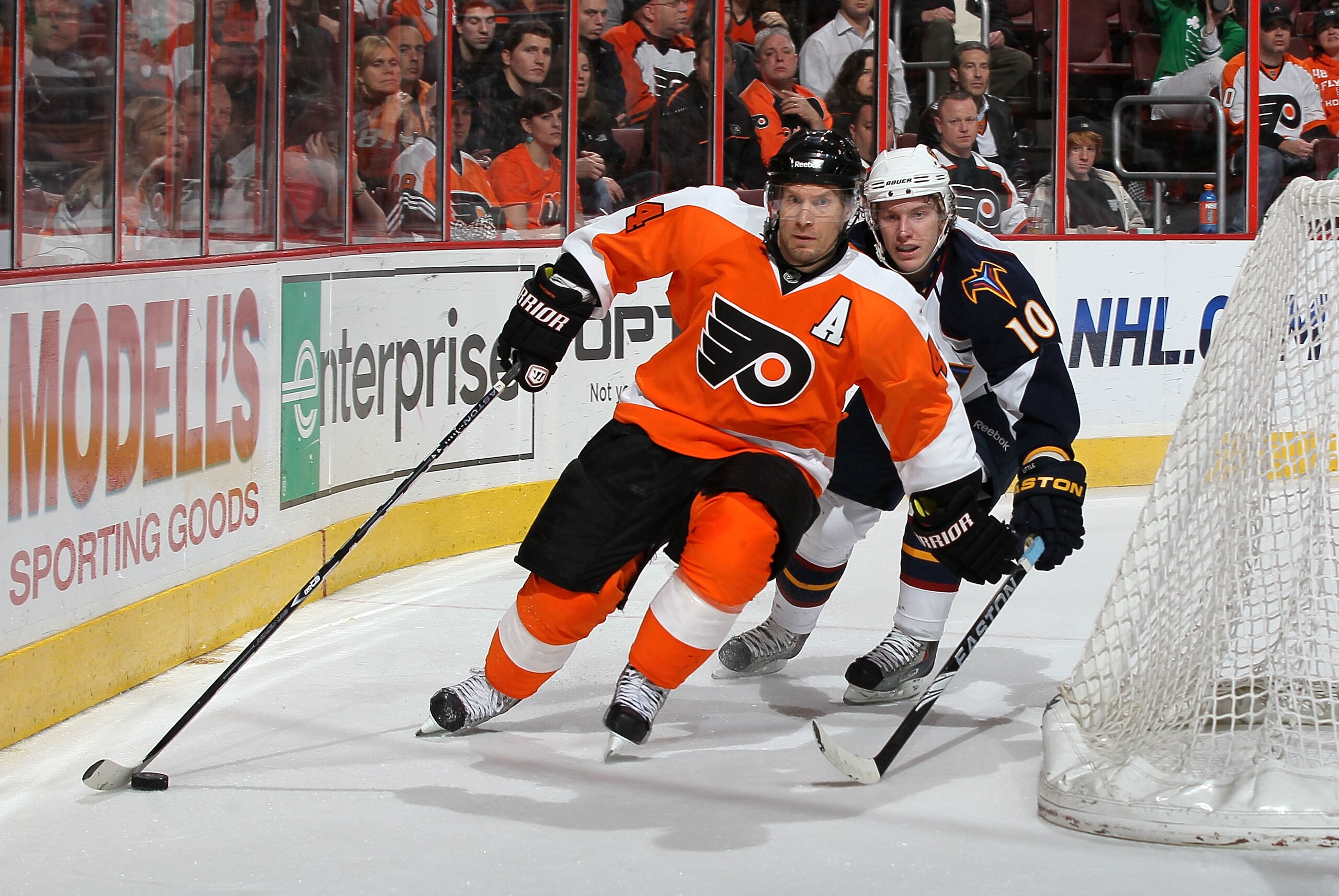 PHILADELPHIA, PA - MARCH 12:  Kimmo Timonen #44 of the Philadelphia Flyers controls the puck against Bryan Little #10 of the Atlanta Thrashers on March 12, 2011 at Wells Fargo Center in Philadelphia, Pennsylvania. The Thrashers defeated the Flyers 5-4  in