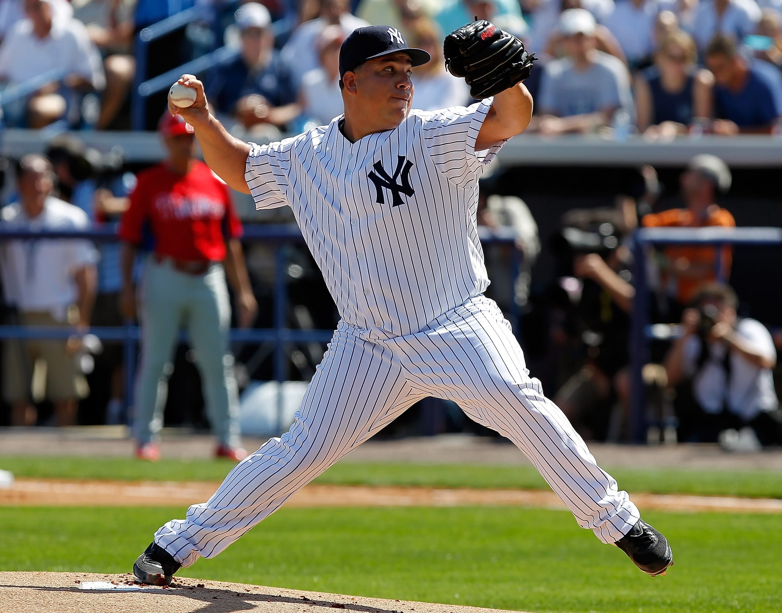 TAMPA, FL - FEBRUARY 26:  Pitcher Bartolo Colon #40 of the New York Yankees pitches against the Philadelphia Phillies during a Grapefruit League Spring Training Game at George M. Steinbrenner Field on February 26, 2011 in Tampa, Florida.  (Photo by J. Mer