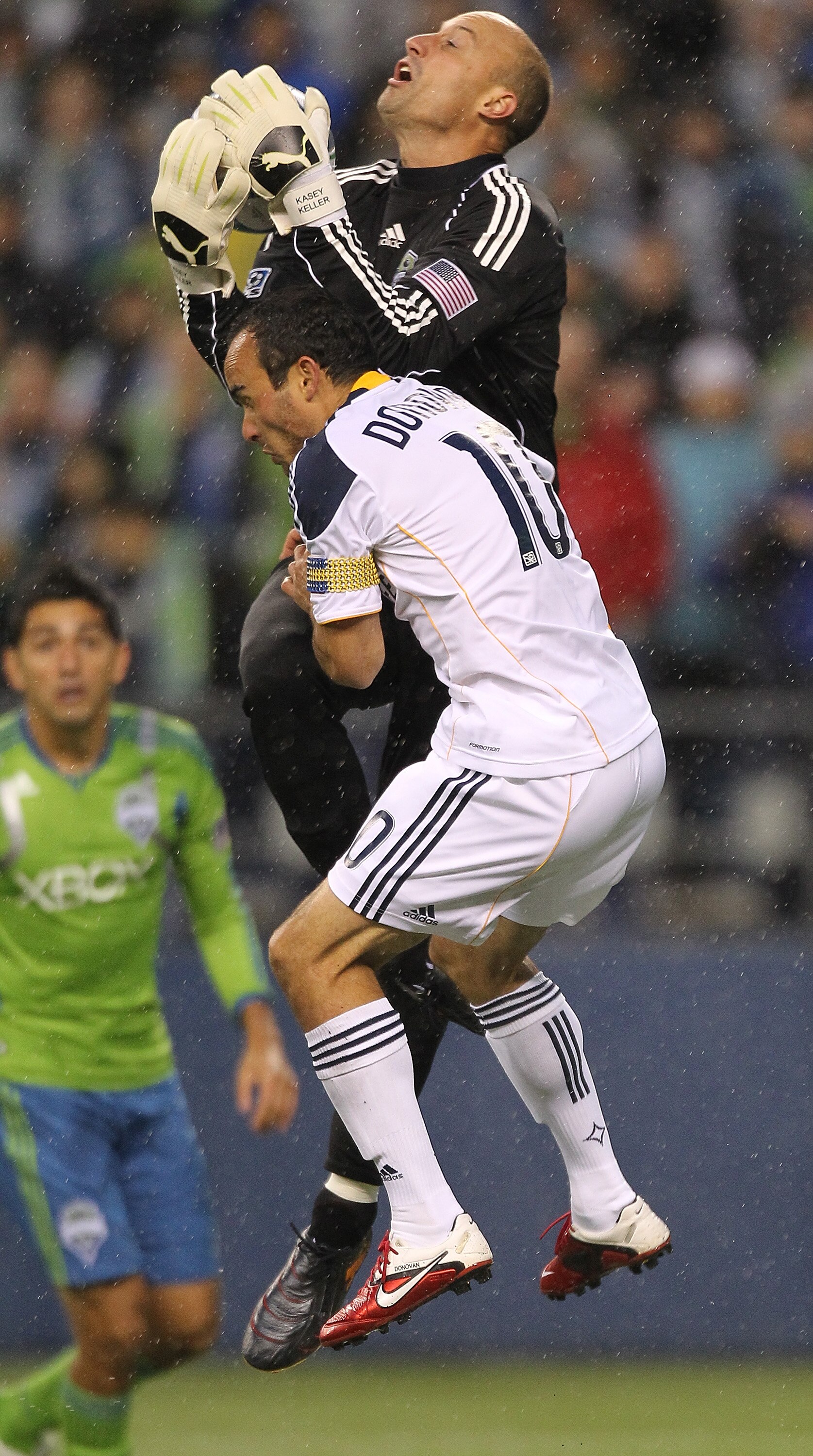 SEATTLE - MARCH 15:  Goalkeeper Kasey Keller #18 of the Seattle Sounders FC hauls in a shot attempt against Landon Donovan #10 of the Los Angeles Galaxy at Qwest Field on March 15, 2011 in Seattle, Washington. The Galaxy defeated the Sounders 1-0. (Photo