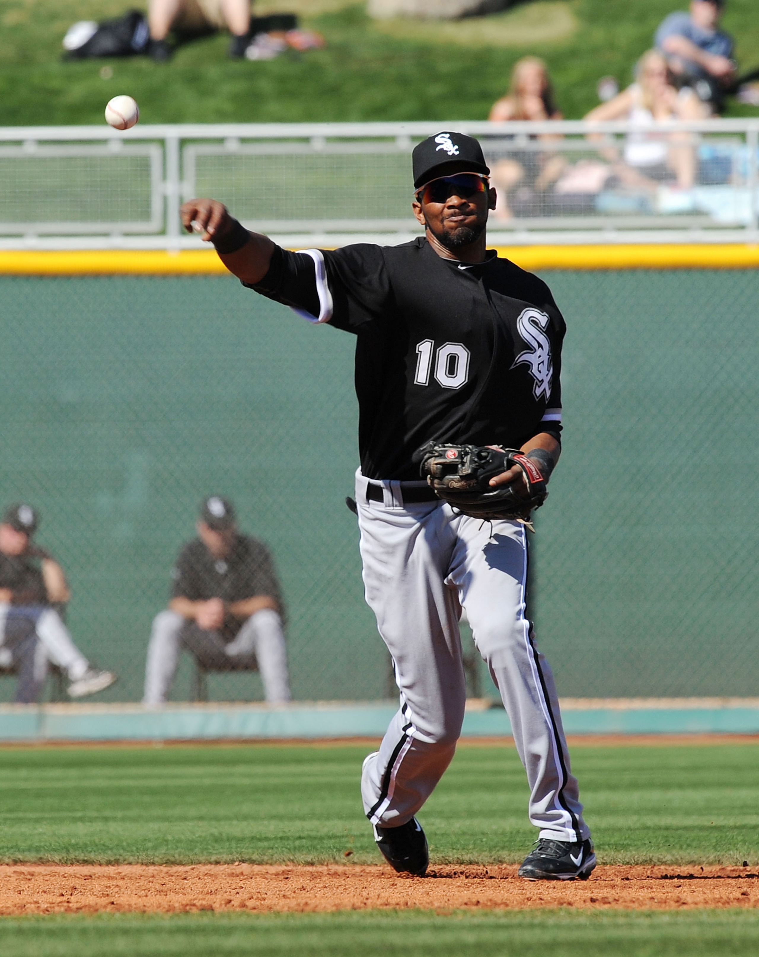 GOODYEAR, AZ - MARCH 02:  Alexi Ramirez #10 of the Chicago White Sox throws the ball to first base agianst the Cincinnati Reds during a spring training game at Goodyear Ballpark on March 2, 2011 in Goodyear, Arizona.  (Photo by Norm Hall/Getty Images)