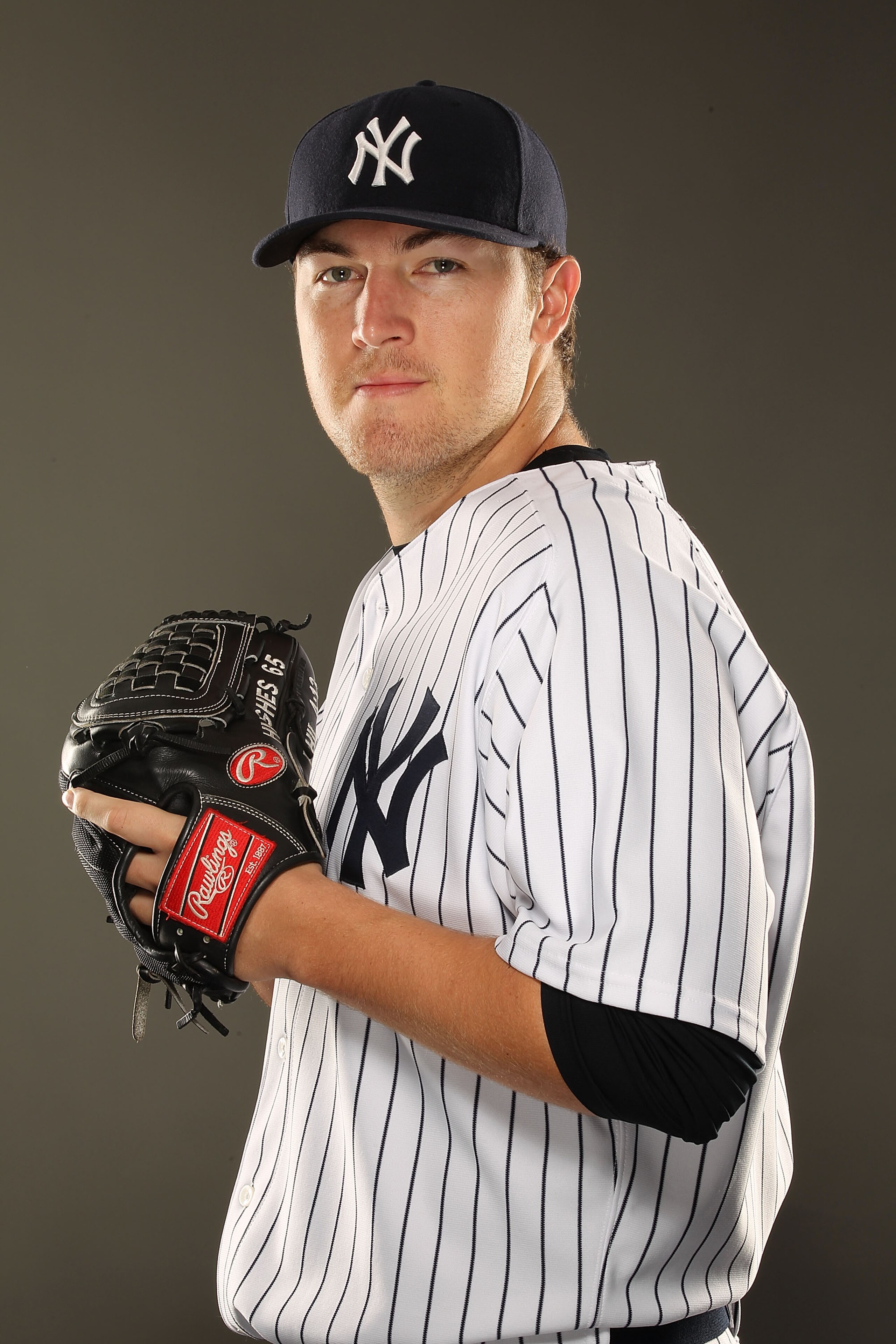 TAMPA, FL - FEBRUARY 23:  Phil Hughes #65 of the New York Yankees poses for a portrait on Photo Day at George M. Steinbrenner Field on February 23, 2011 in Tampa, Florida.  (Photo by Al Bello/Getty Images)