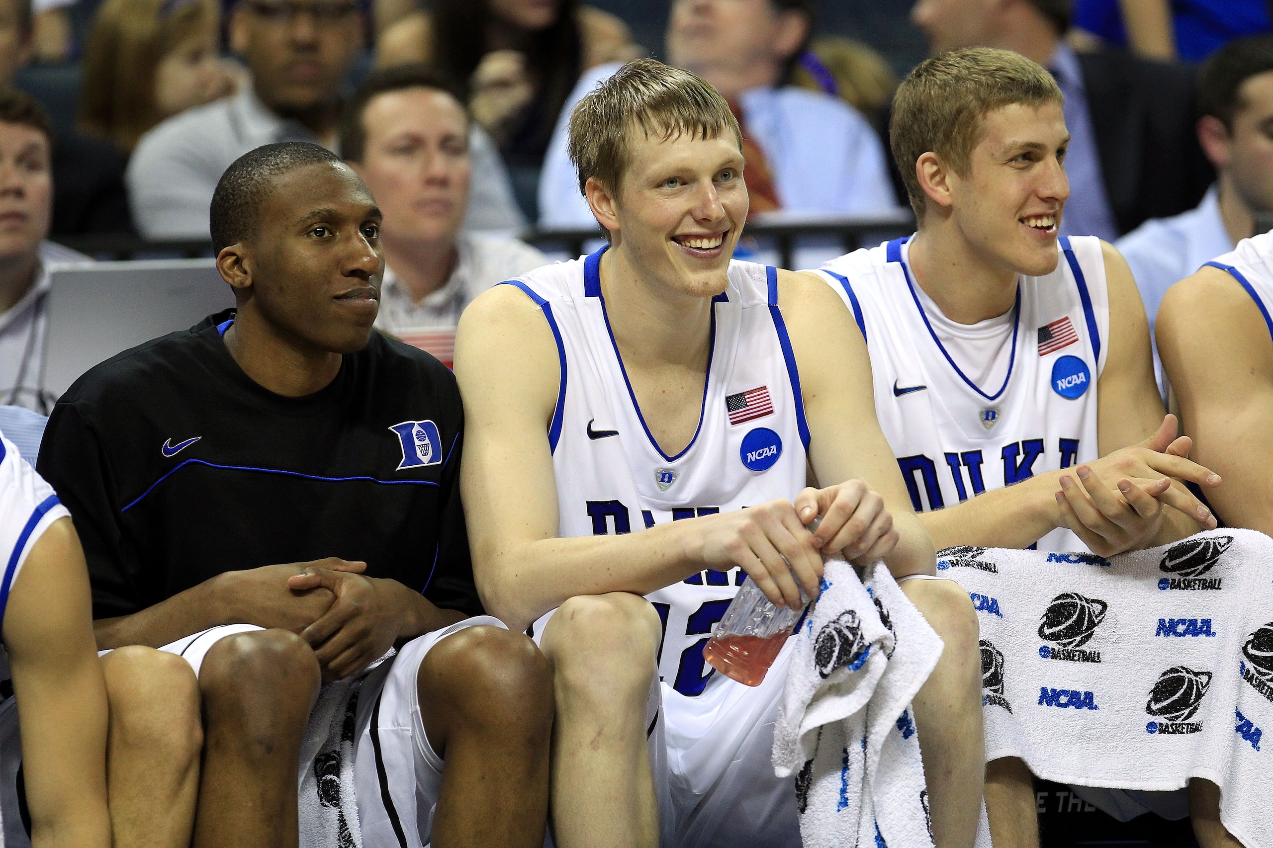 CHARLOTTE, NC - MARCH 18: (L-R) Nolan Smith #2, Kyle Singler #12 and Mason Plumlee #5 of the Duke Blue Devils sit on the bench in the second half while taking on the Hampton Pirates during the second round of the 2011 NCAA men's basketball tournament at CHARLOTTE, NC - MARCH 18: (L-R) Nolan Smith #2, Kyle Singler #12 and Mason Plumlee #5 of the Duke Blue Devils sit on the bench in the second half while taking on the Hampton Pirates during the second round of the 2011 NCAA men's basketball tournament at