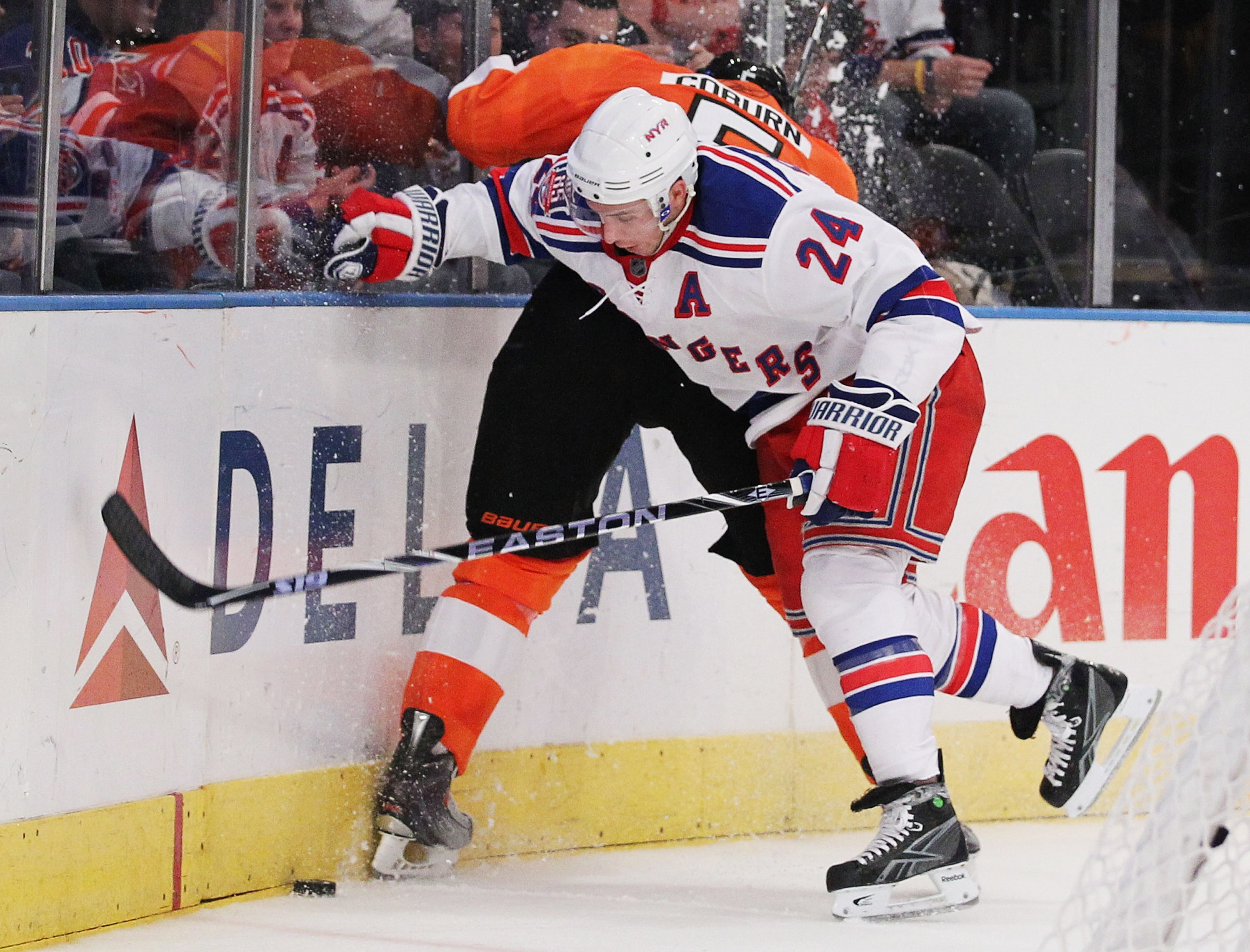 NEW YORK - MARCH 6:  Ryan Callahan #24 of the New York Rangers checks Braydon Coburn #5 of the Philadelphia Flyers during their game on March 6, 2011 at Madison Square Garden in New York City, New York.  (Photo by Al Bello/Getty Images)