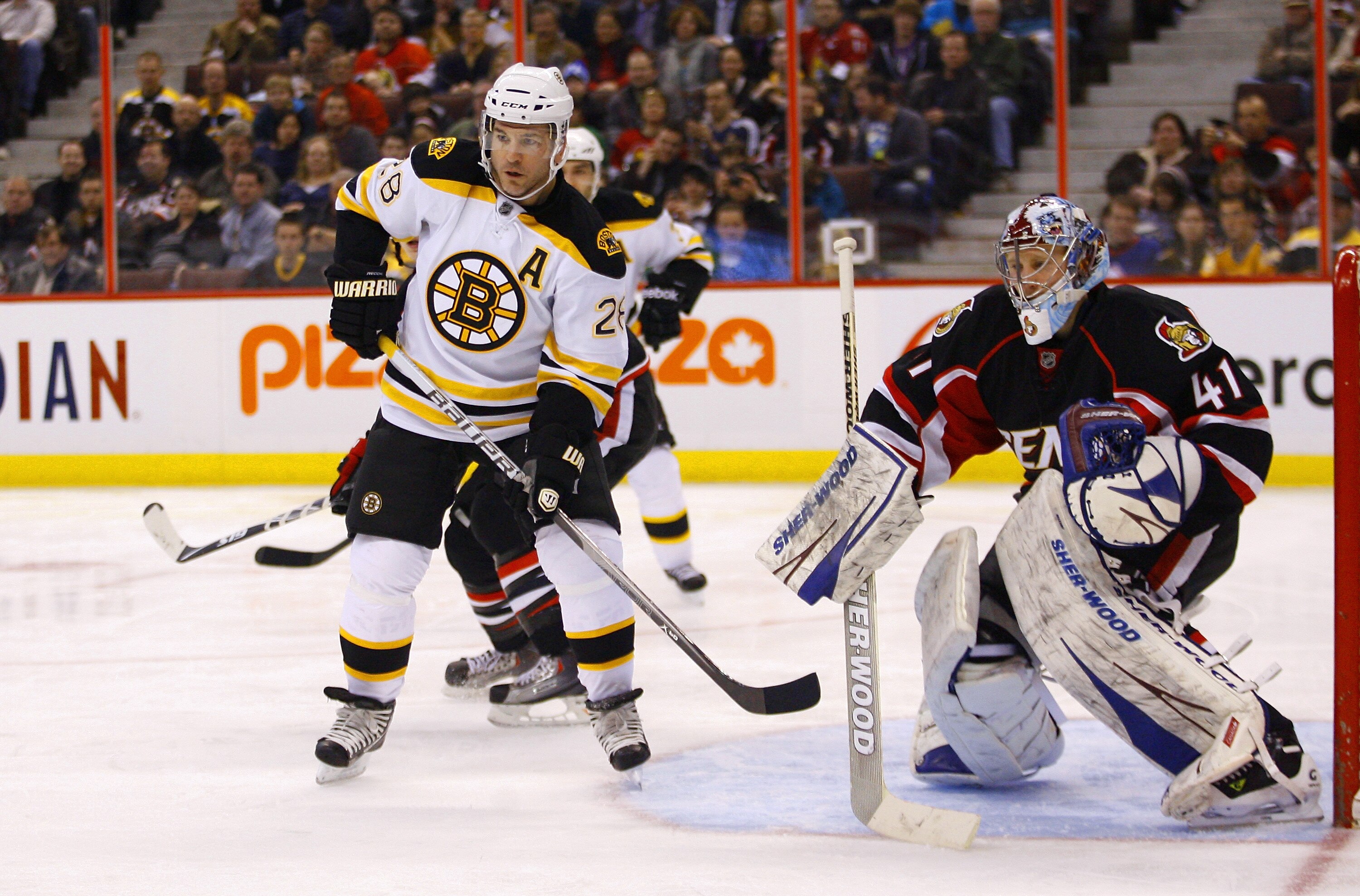 OTTAWA, CANADA - MARCH 01:  Mark Recchi #28 of the Boston Bruins plants himself at the top of the crease out front of Craig Anderson #41 of the Ottawa Senators in a game at Scotiabank Place on March 1, 2011 in Ottawa, Canada.  (Photo by Phillip MacCallum/