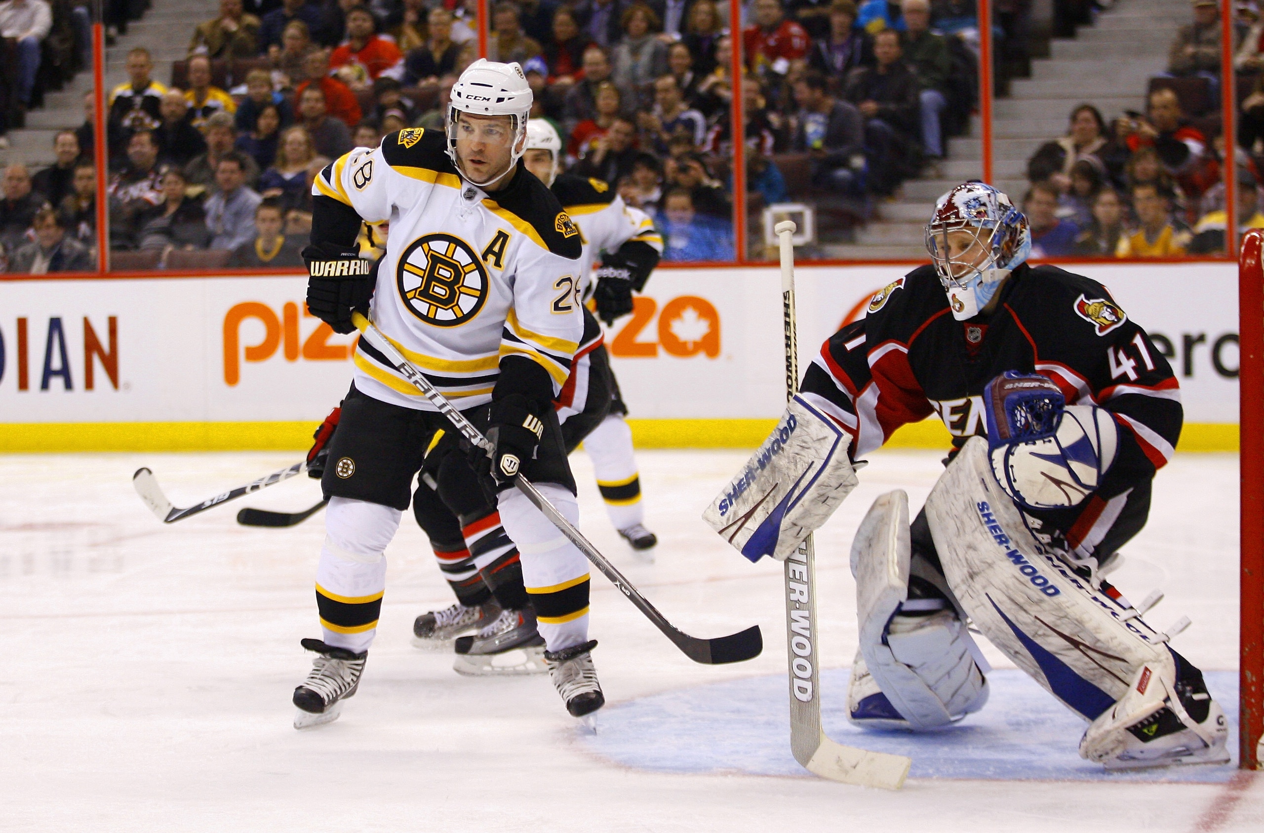 OTTAWA, CANADA - MARCH 01:  Mark Recchi #28 of the Boston Bruins plants himself at the top of the crease out front of Craig Anderson #41 of the Ottawa Senators in a game at Scotiabank Place on March 1, 2011 in Ottawa, Canada.  (Photo by Phillip MacCallum/