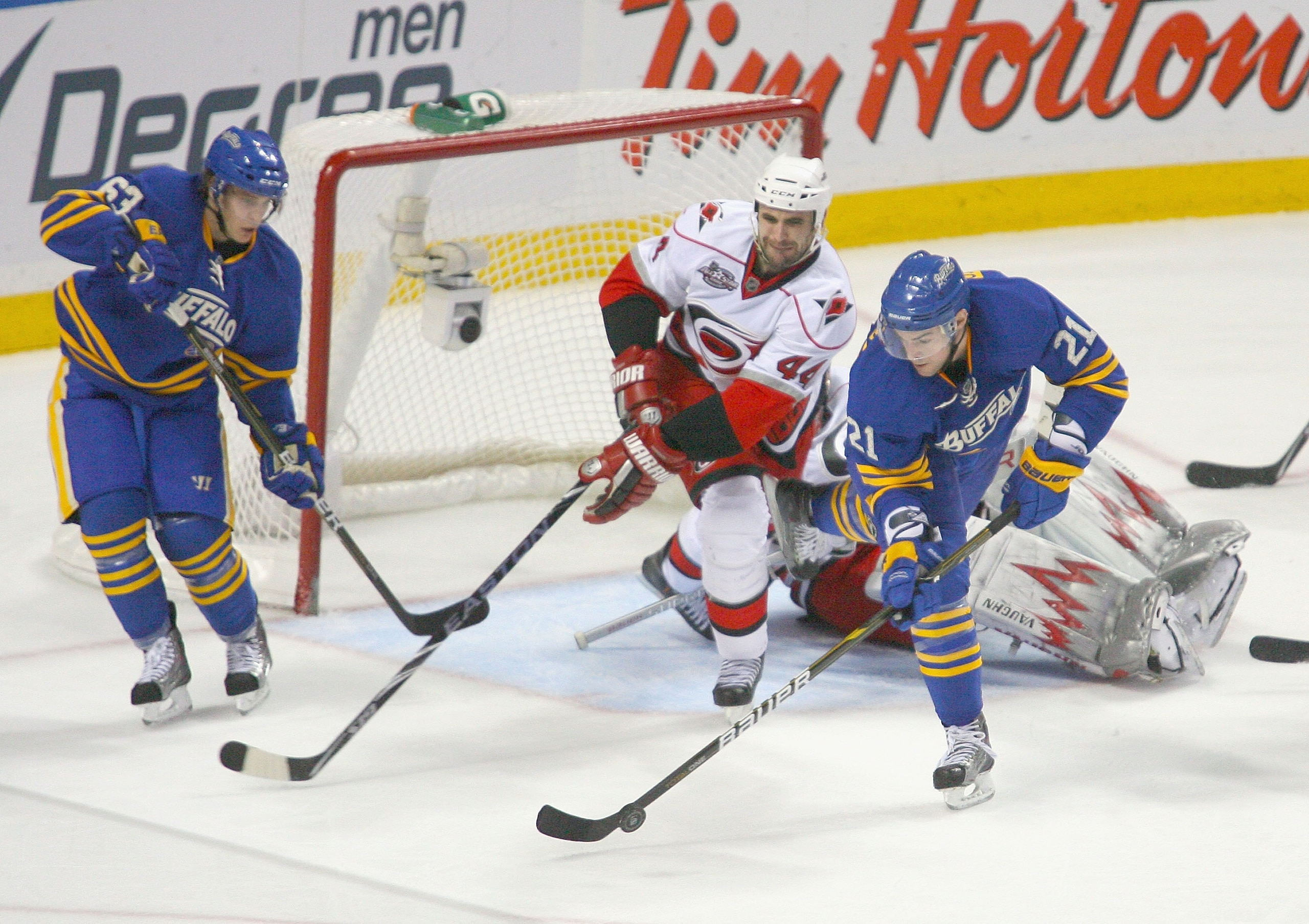 BUFFALO, NY - MARCH 15: Jay Harrison #44 of the Carolina Hurricanes defends against  Drew Stafford #21 and Tyler Ennis #63 of  Buffalo Sabres  at HSBC Arena on March 15, 2011 in Buffalo, New York.  (Photo by Rick Stewart/Getty Images)