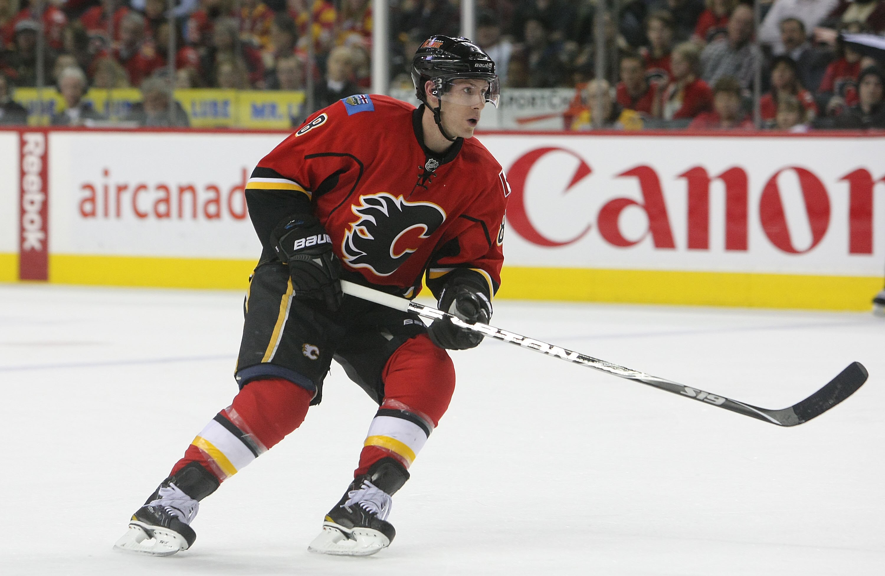 CALGARY,CANADA - FEBRUARY 22:  Brendan Morrison #8 of the Calgary Flames skates against the Boston Bruins during their NHL game at Scotiabank Saddledome, February 22,2011 in Calgary, Alberta, Canada.(Photo By Dave Sandford/Getty Images)