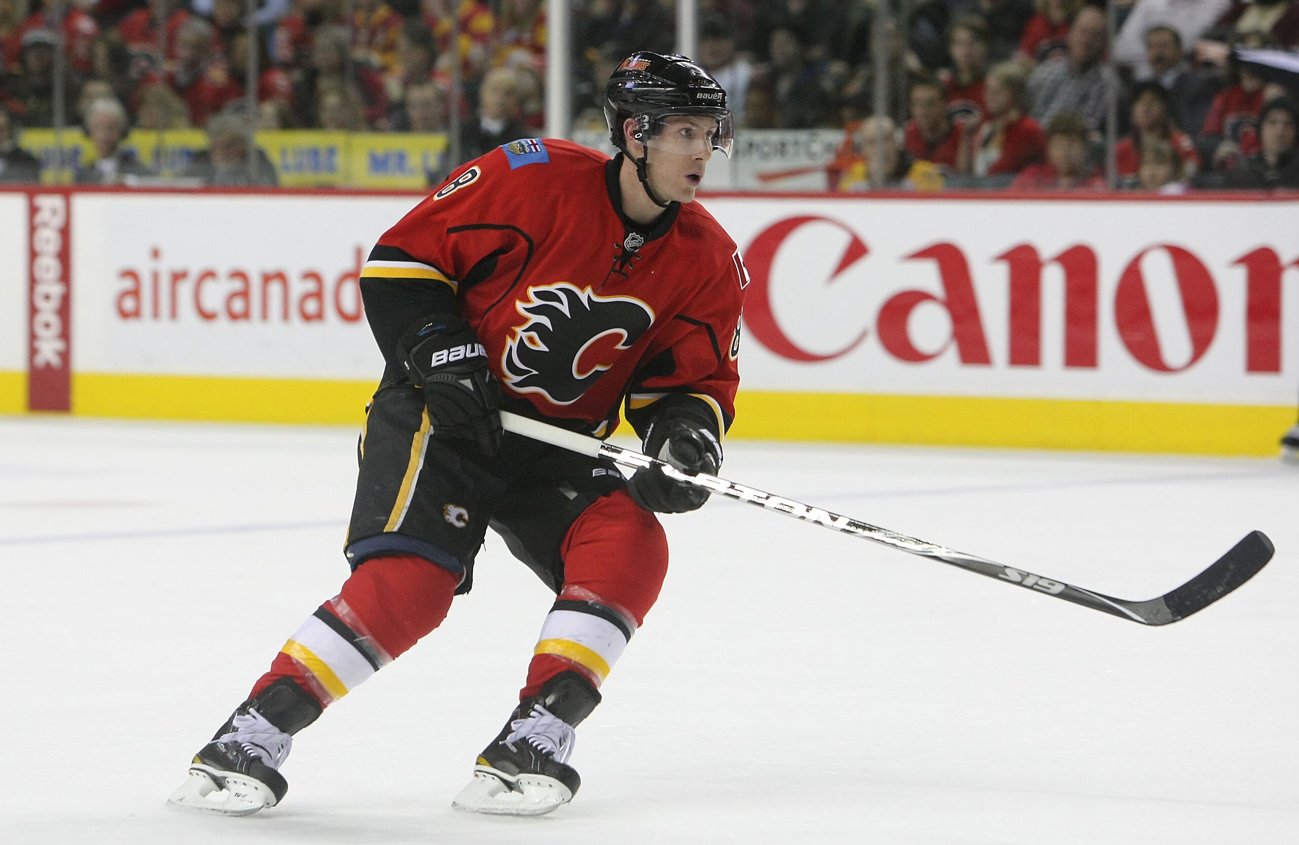 CALGARY,CANADA - FEBRUARY 22:  Brendan Morrison #8 of the Calgary Flames skates against the Boston Bruins during their NHL game at Scotiabank Saddledome, February 22,2011 in Calgary, Alberta, Canada.(Photo By Dave Sandford/Getty Images)