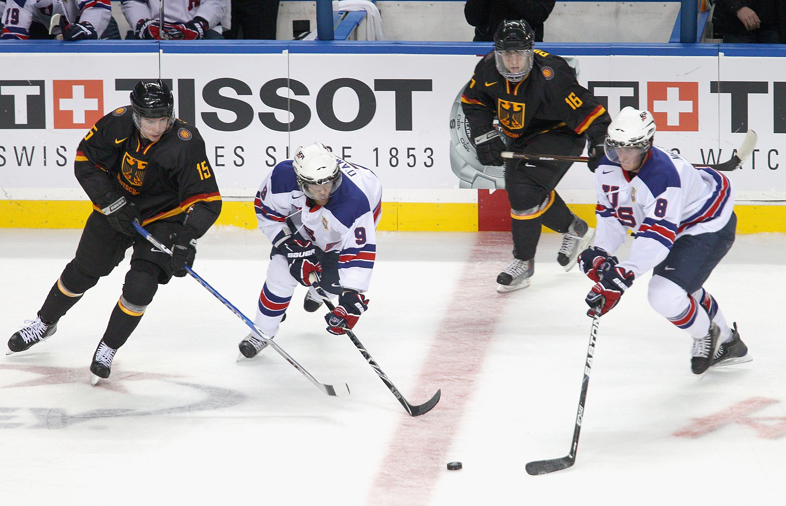 BUFFALO, NY - DECEMBER 30: Jerry D Amigo #9 and Brock Nelson #8 of the United States skate against Marcel Noebels #15 and Tobias Rieder #16 of Germany during the 2011 IIHF World U20 Championship game between United States and Germany at the HSBC Arena on