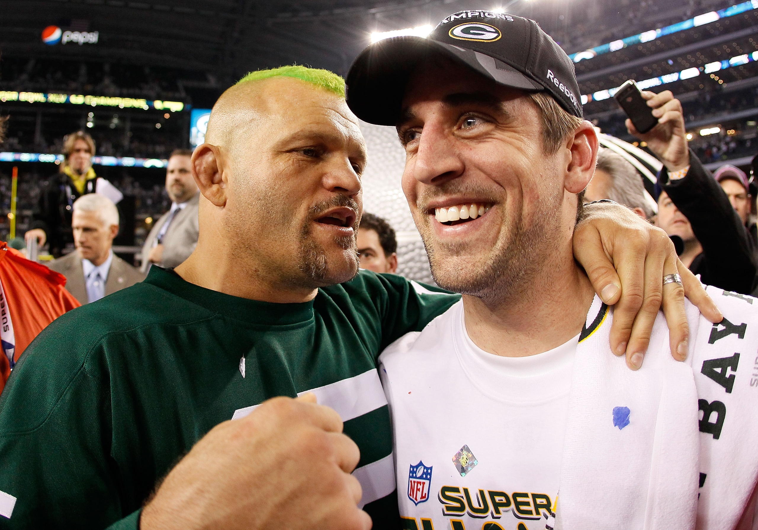 ARLINGTON, TX - FEBRUARY 06:  Former UFC Champion Chuck Liddell and Super Bowl MVP Aaron Rodgers #12 of the Green Bay Packers celebrate after the Packers won Super Bowl XLV 31-25 against the Pittsburgh Steelers at Cowboys Stadium on February 6, 2011 in Ar