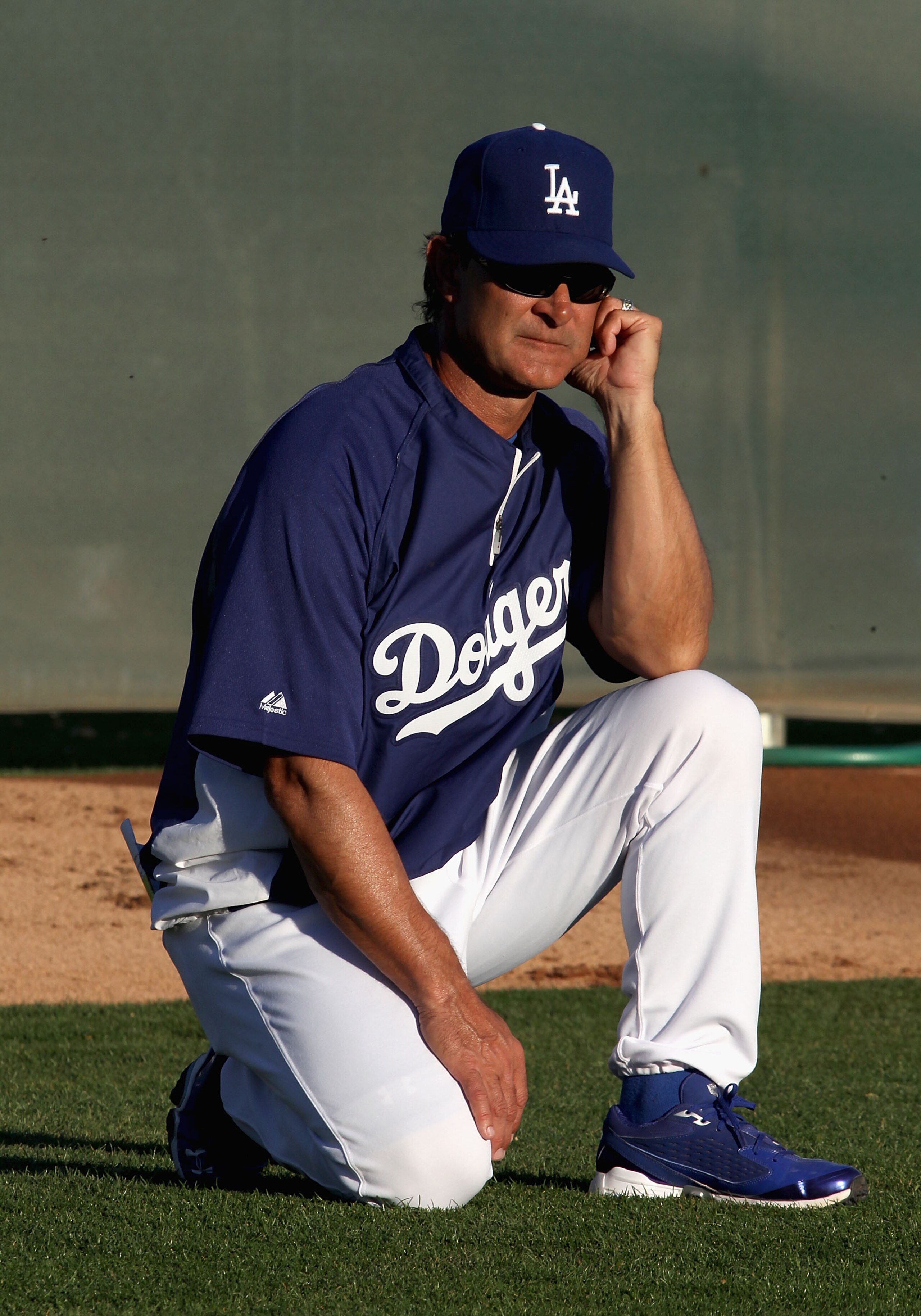 GLENDALE, AZ - MARCH 04:  Manager Don Mattingly of the Los Angeles Dodgers watches warm ups before the spring training game against the San Francisco Giants at Camelback Ranch on March 4, 2011 in Glendale, Arizona.  (Photo by Christian Petersen/Getty Imag