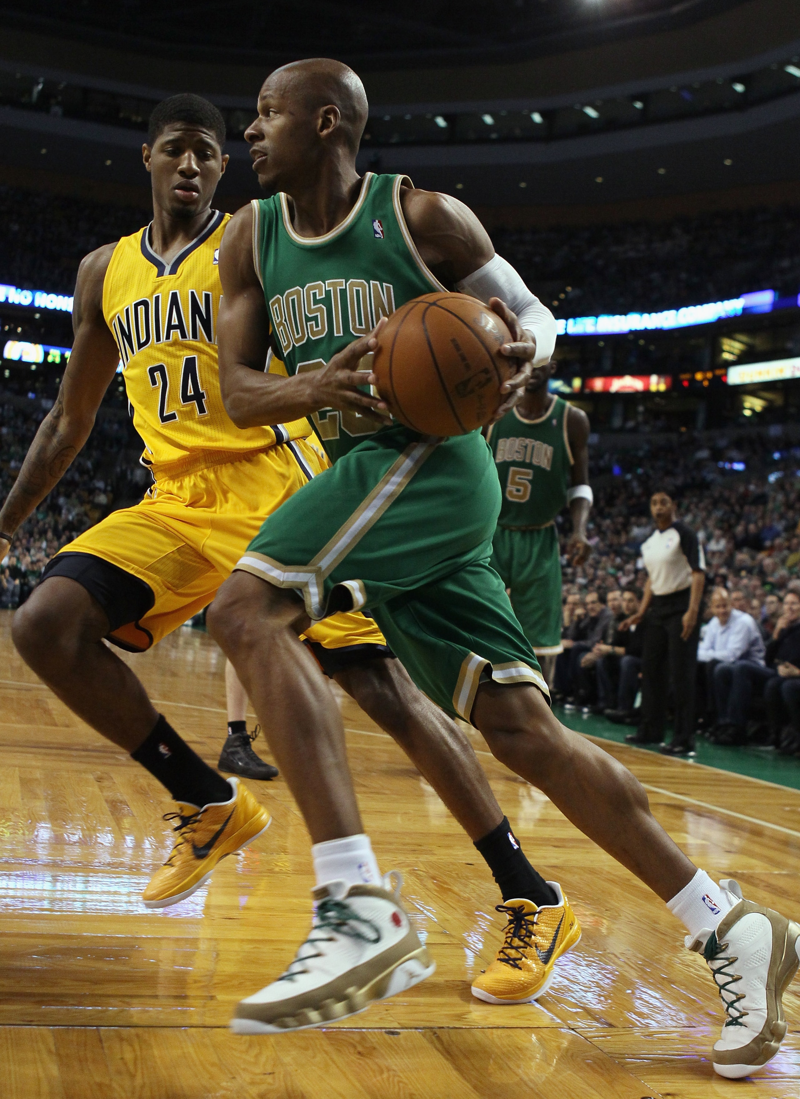 BOSTON, MA - MARCH 16:  Ray Allen #20 of the Boston Celtics drives to the net as Paul George #24 of the Indiana Pacers defends on March 16, 2011 at the TD Garden in Boston, Massachusetts.  NOTE TO USER: User expressly acknowledges and agrees that, by down