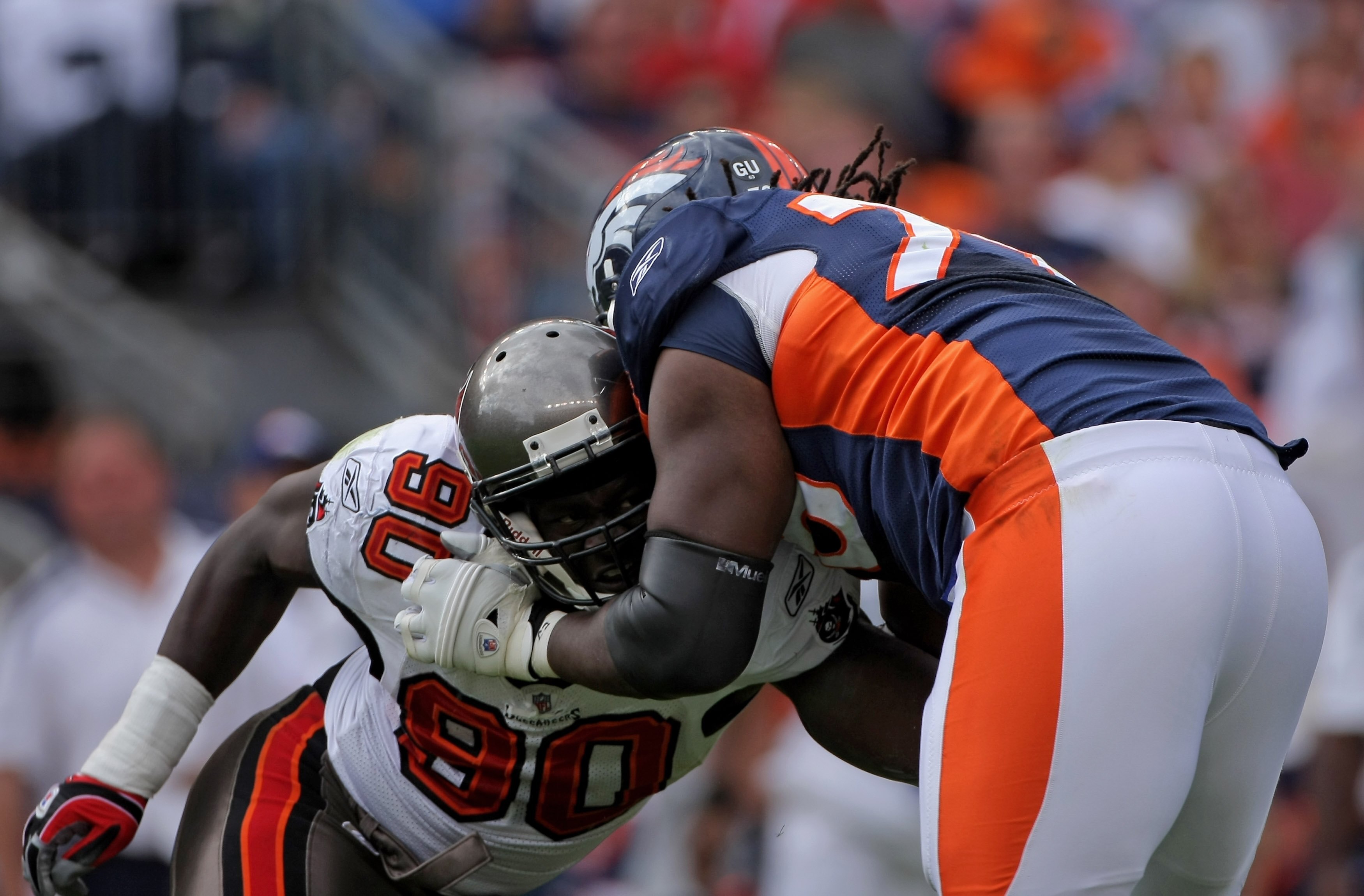 DENVER - OCTOBER 05:  Offensive tackle Ryan Clady #78 of the Denver Broncos blocks the rush of Gaines Adams #90 of the Tampa Bay Buccaneers during NFL action on October 5, 2008 in Denver, Colorado. The Broncos defeated the Buccaneers 16-13.  (Photo by Dou