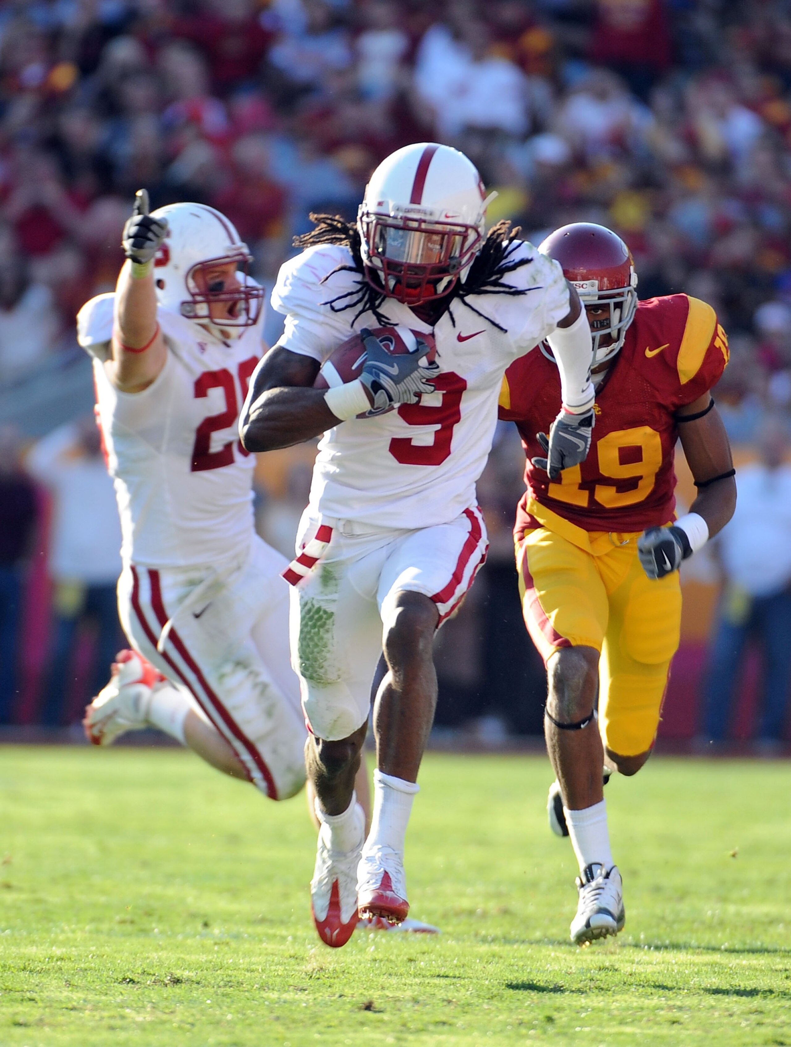 LOS ANGELES, CA - NOVEMBER 14:  Richard Sherman #9 of the Stanford Cardinal makes an interception leading to a touchdown in front of Drew McAllister #19 of the USC Trojans during the second half at the Los Angeles Memorial Coliseum on November 14, 2009 in
