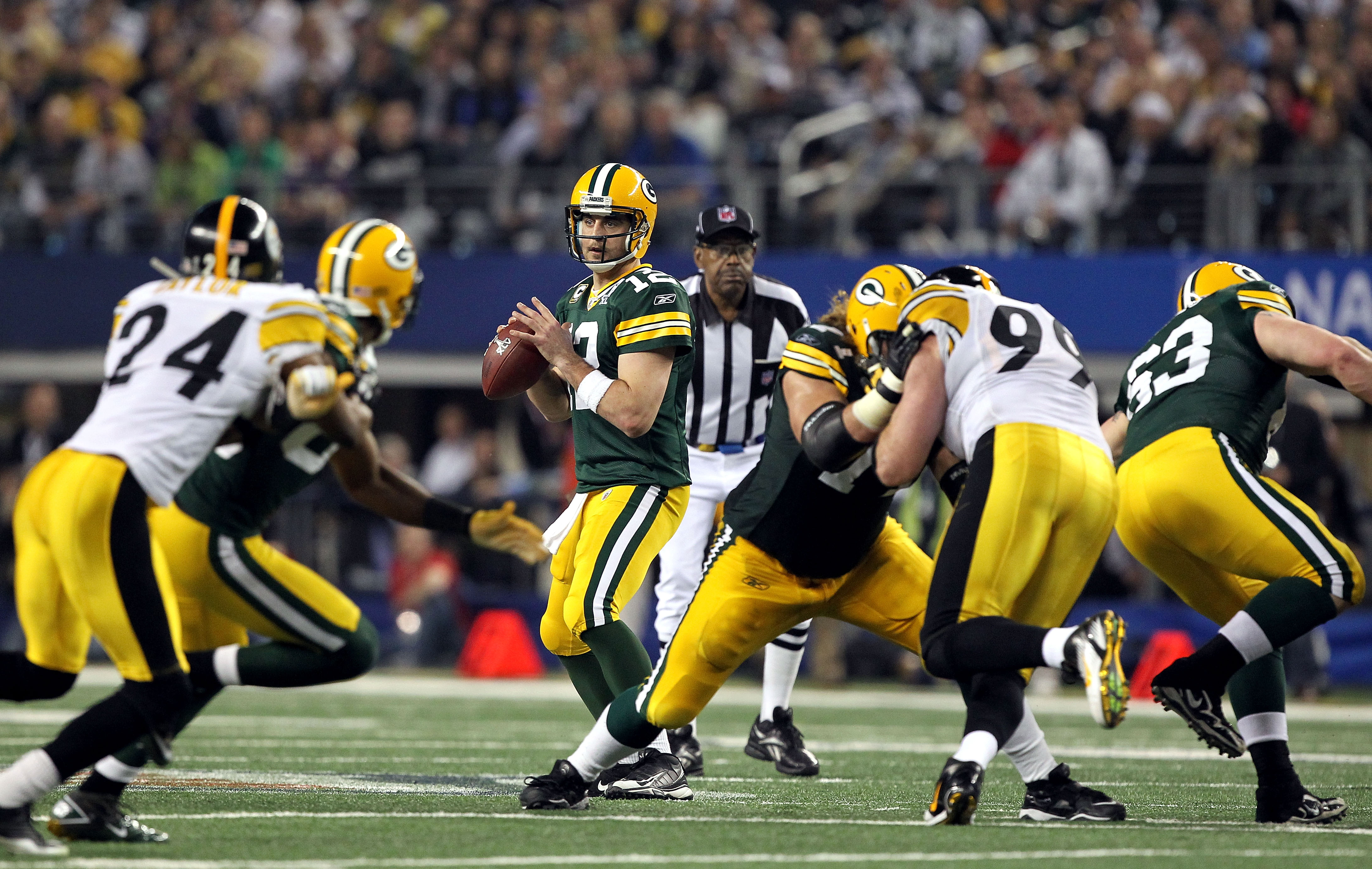 ARLINGTON, TX - FEBRUARY 06:  Quarterback Aaron Rodgers #12 of the Green Bay Packers looks to pass the ball against the Pittsburgh Steelers during Super Bowl XLV at Cowboys Stadium on February 6, 2011 in Arlington, Texas. The Packers won 31-25. (Photo by