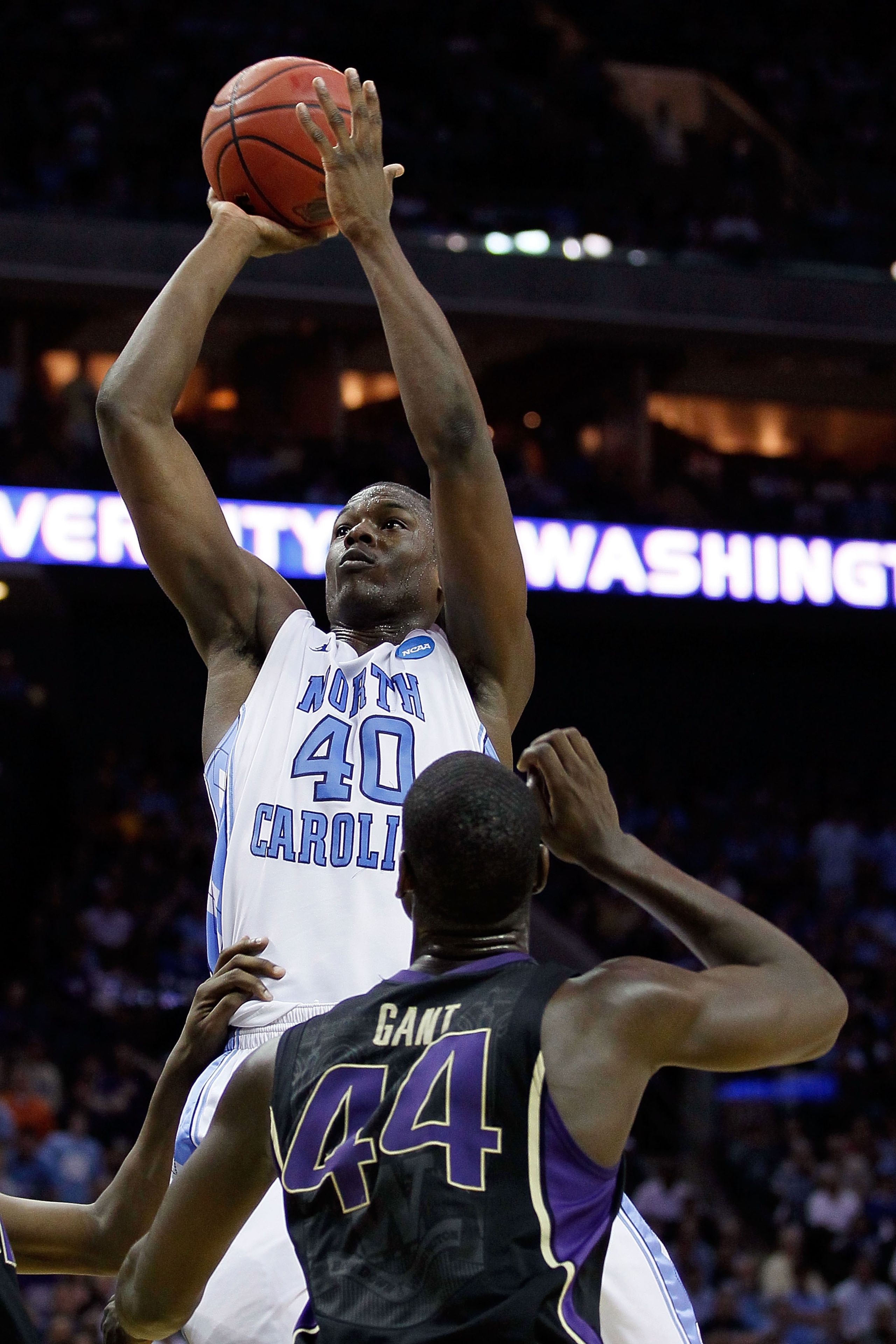 CHARLOTTE, NC - MARCH 20: Harrison Barnes #40 of the North Carolina Tar Heels shoots over Darnell Gant #44 of the Washington Huskies during the third round of the 2011 NCAA men's basketball tournament at Time Warner Cable Arena on March 20, 2011 in Charl CHARLOTTE, NC - MARCH 20: Harrison Barnes #40 of the North Carolina Tar Heels shoots over Darnell Gant #44 of the Washington Huskies during the third round of the 2011 NCAA men's basketball tournament at Time Warner Cable Arena on March 20, 2011 in Charl