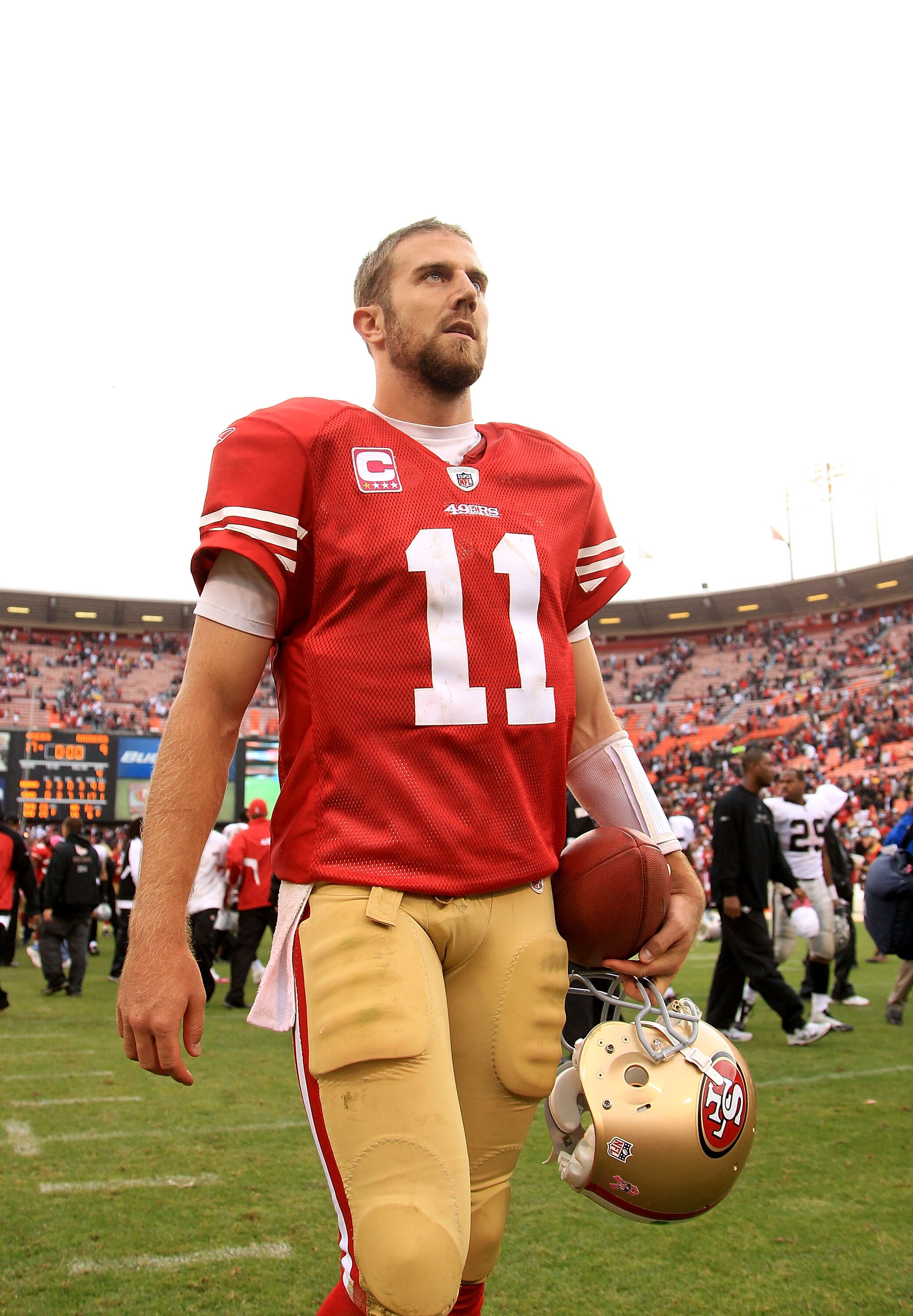SAN FRANCISCO - OCTOBER 17: Alex Smith #11 of the San Francisco 49ers walks off the field after they beat the Oakland Raiders at Candlestick Park on October 17, 2010 in San Francisco, California.  (Photo by Ezra Shaw/Getty Images)