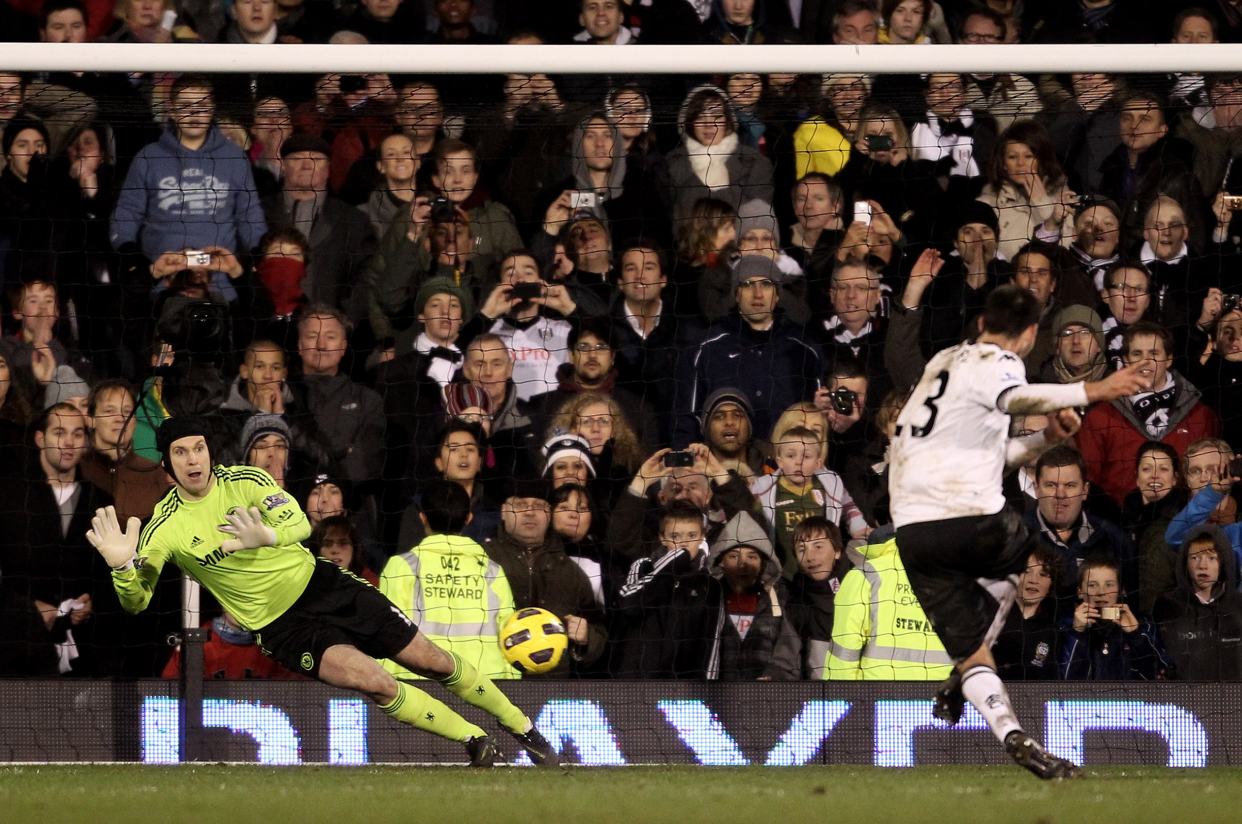 LONDON, ENGLAND - FEBRUARY 14:  Petr Cech of Chelsea saves a penalty from Clint Dempsey of Fulham during the Barclays Premier League match between Fulham and Chelsea at Craven Cottage on February 14, 2011 in London, England.  (Photo by Scott Heavey/Getty