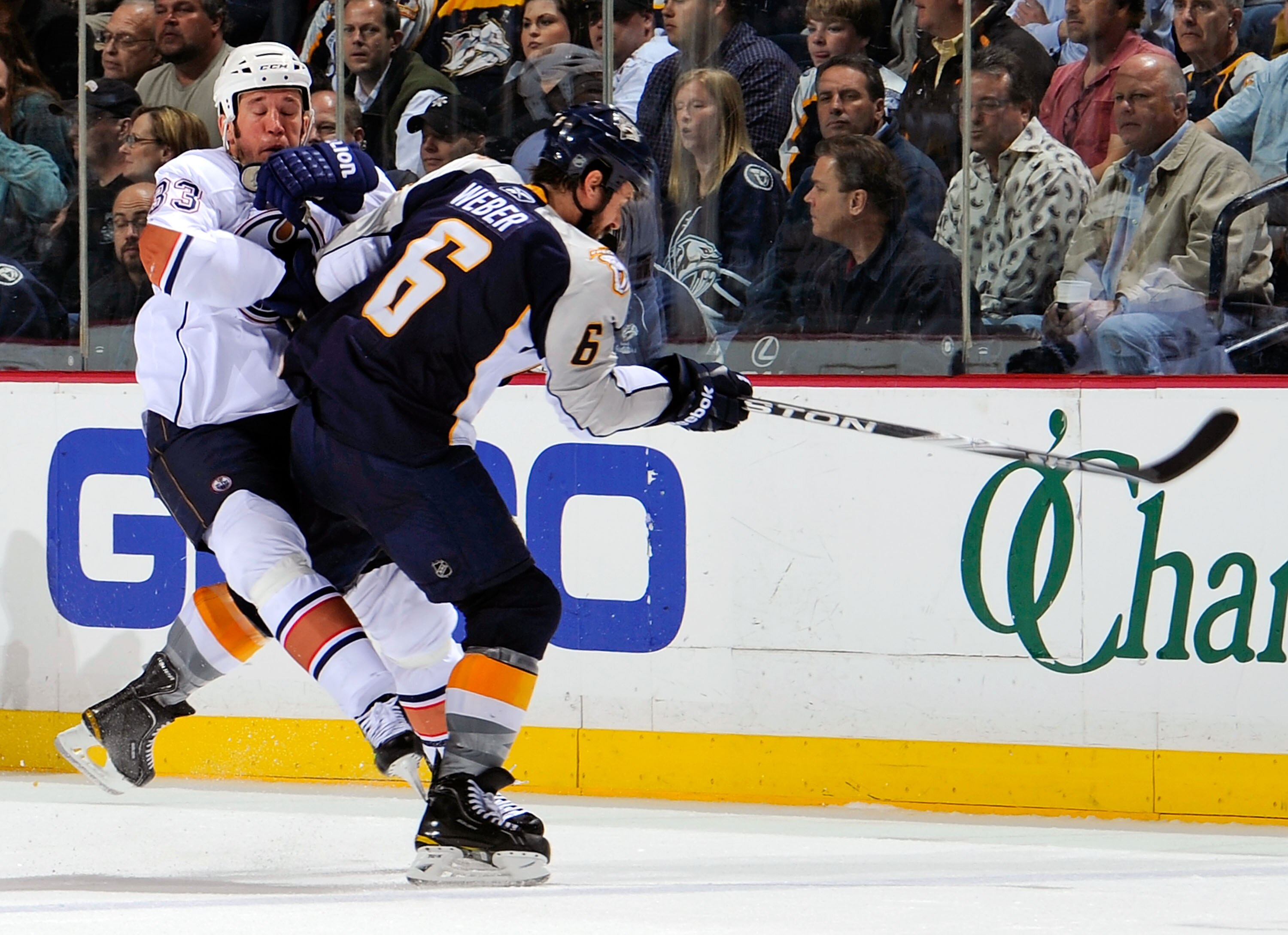 NASHVILLE, TN - MARCH 22:  Steve MacIntyre #33 of the Edmonton Oilers collides with Shea Weber #6 of the Nashville Predators on March 22, 2011 at the Bridgestone Arena in Nashville, Tennessee.  (Photo by Frederick Breedon/Getty Images)