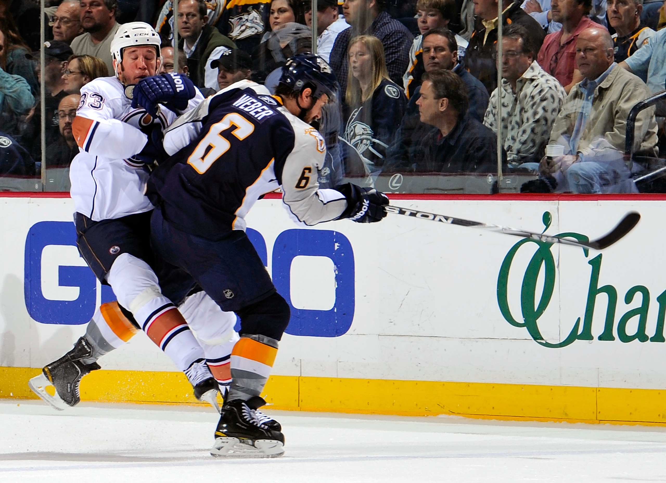 NASHVILLE, TN - MARCH 22:  Steve MacIntyre #33 of the Edmonton Oilers collides with Shea Weber #6 of the Nashville Predators on March 22, 2011 at the Bridgestone Arena in Nashville, Tennessee.  (Photo by Frederick Breedon/Getty Images)