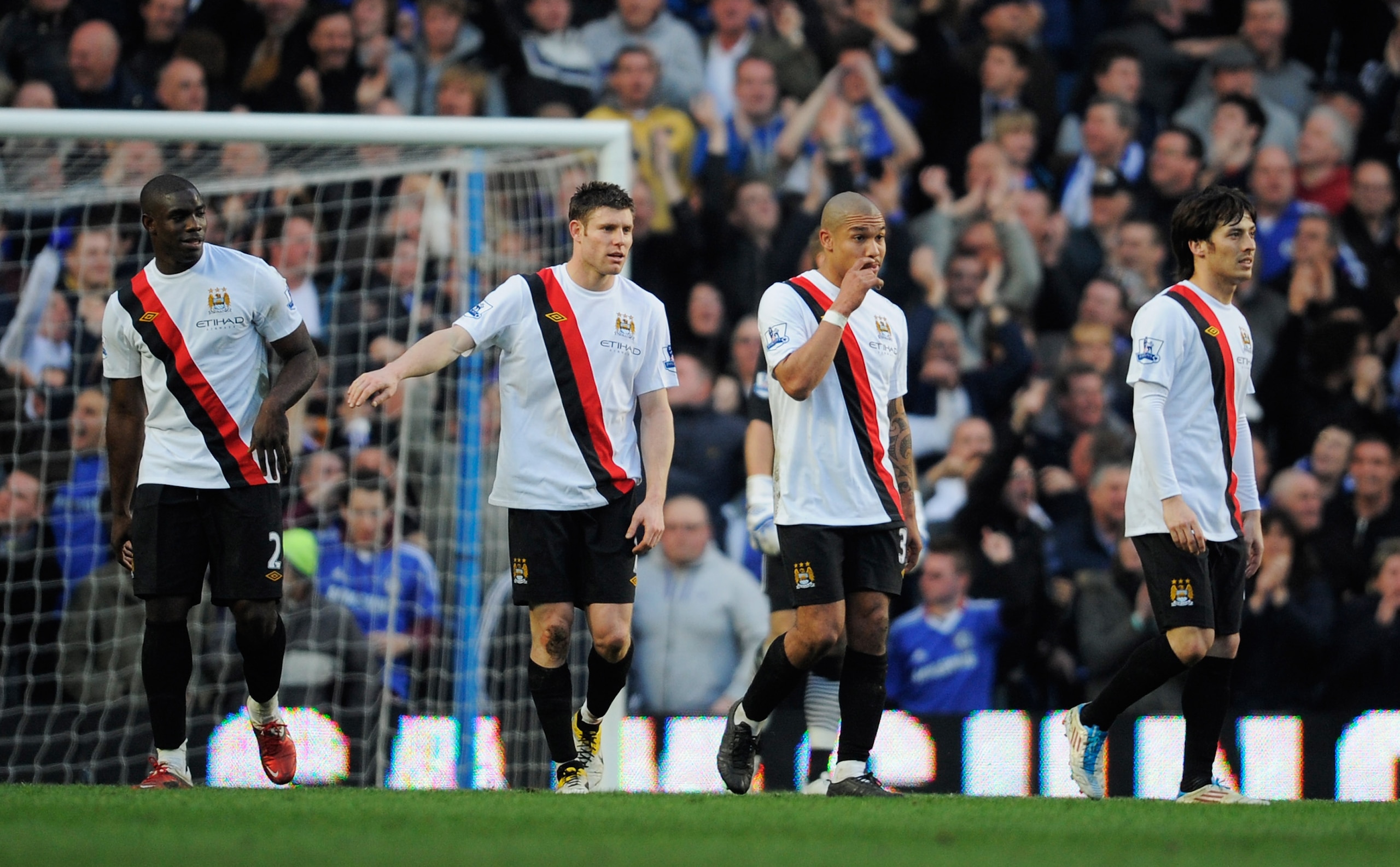 LONDON, ENGLAND - MARCH 20:  (L-R) Micah Richards, James Milner, Nigel de Jong and David Silva of Manchester City look dejected during the Barclays Premier League match between Chelsea and Manchester City at Stamford Bridge on March 20, 2011 in London, En