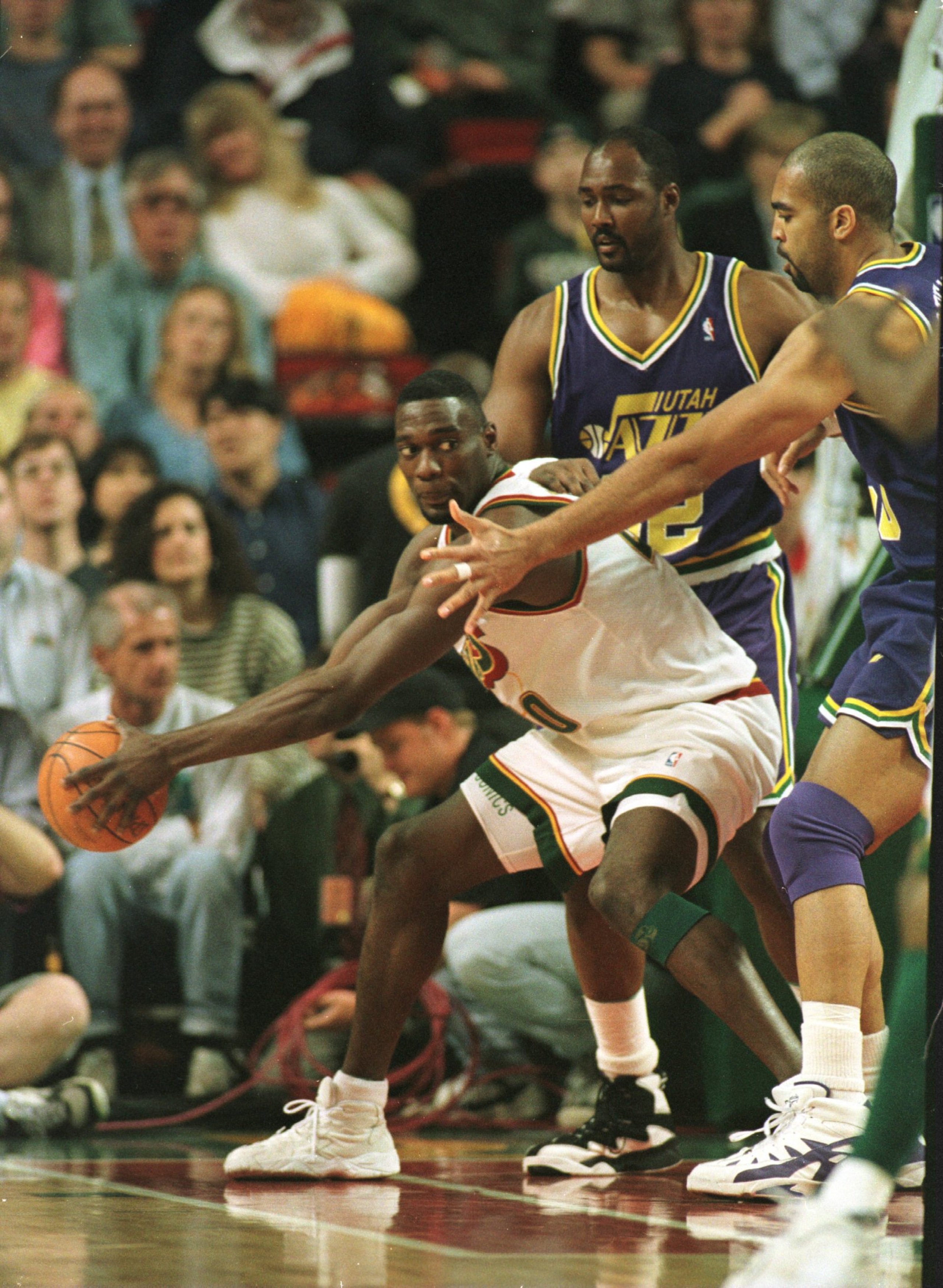 20 May 1996:  Forward Shawn Kemp #40 of the Seattle Supersonics drives against Karl Malone #32 and Felton Spencer #50 of the Utah Jazz during first half action of Game 2 of the NBA Western Conference Finals at Key Arena in Seattle, Washington. Mandatory C