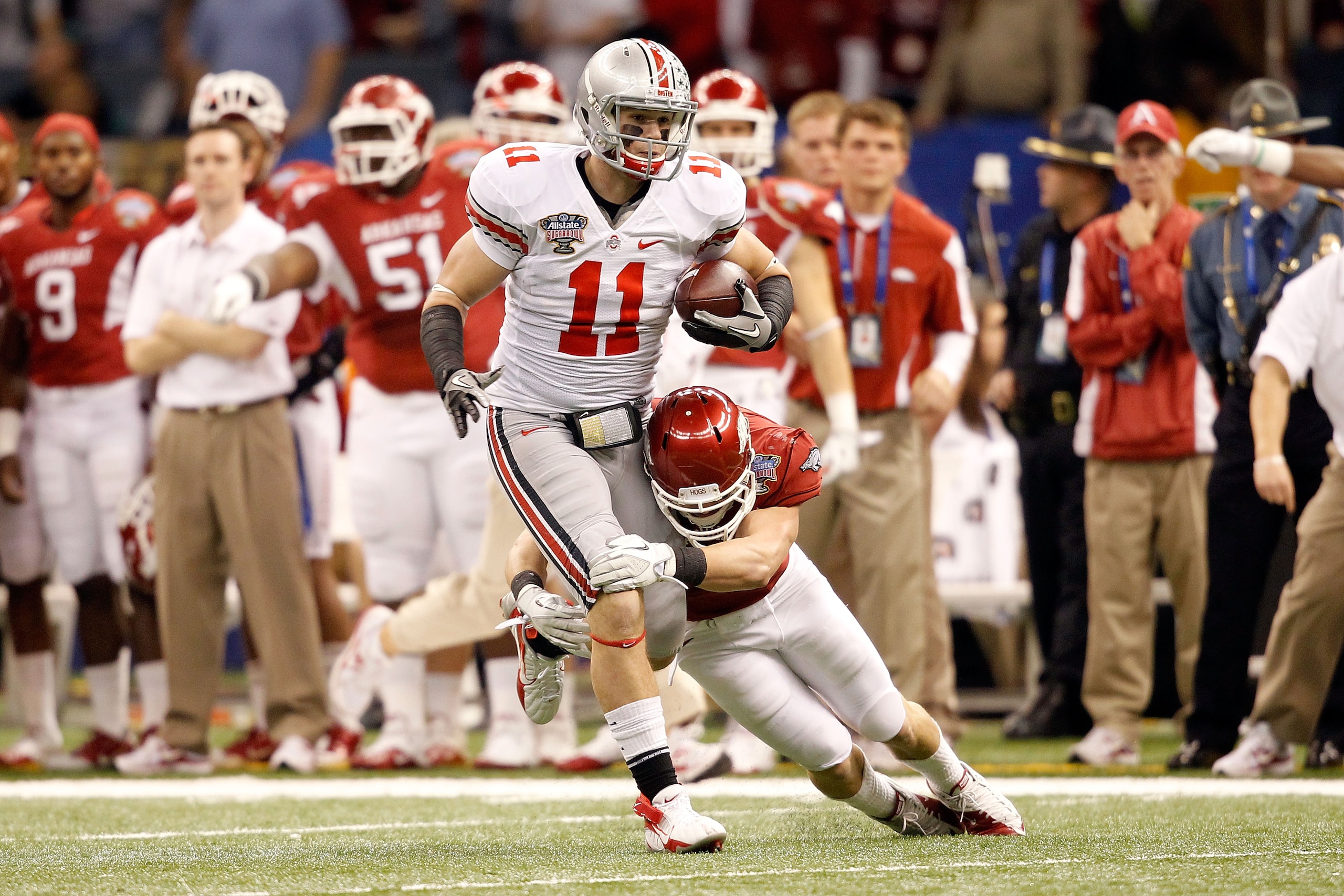 NEW ORLEANS, LA - JANUARY 04: Jake Stoneburner #11 of the Ohio State Buckeyes runs after a catch against the Arkansas Razorbacks in the first quarter in the Allstate Sugar Bowl at the Louisiana Superdome on January 4, 2011 in New Orleans, Louisiana. (Ph NEW ORLEANS, LA - JANUARY 04: Jake Stoneburner #11 of the Ohio State Buckeyes runs after a catch against the Arkansas Razorbacks in the first quarter in the Allstate Sugar Bowl at the Louisiana Superdome on January 4, 2011 in New Orleans, Louisiana. (Ph