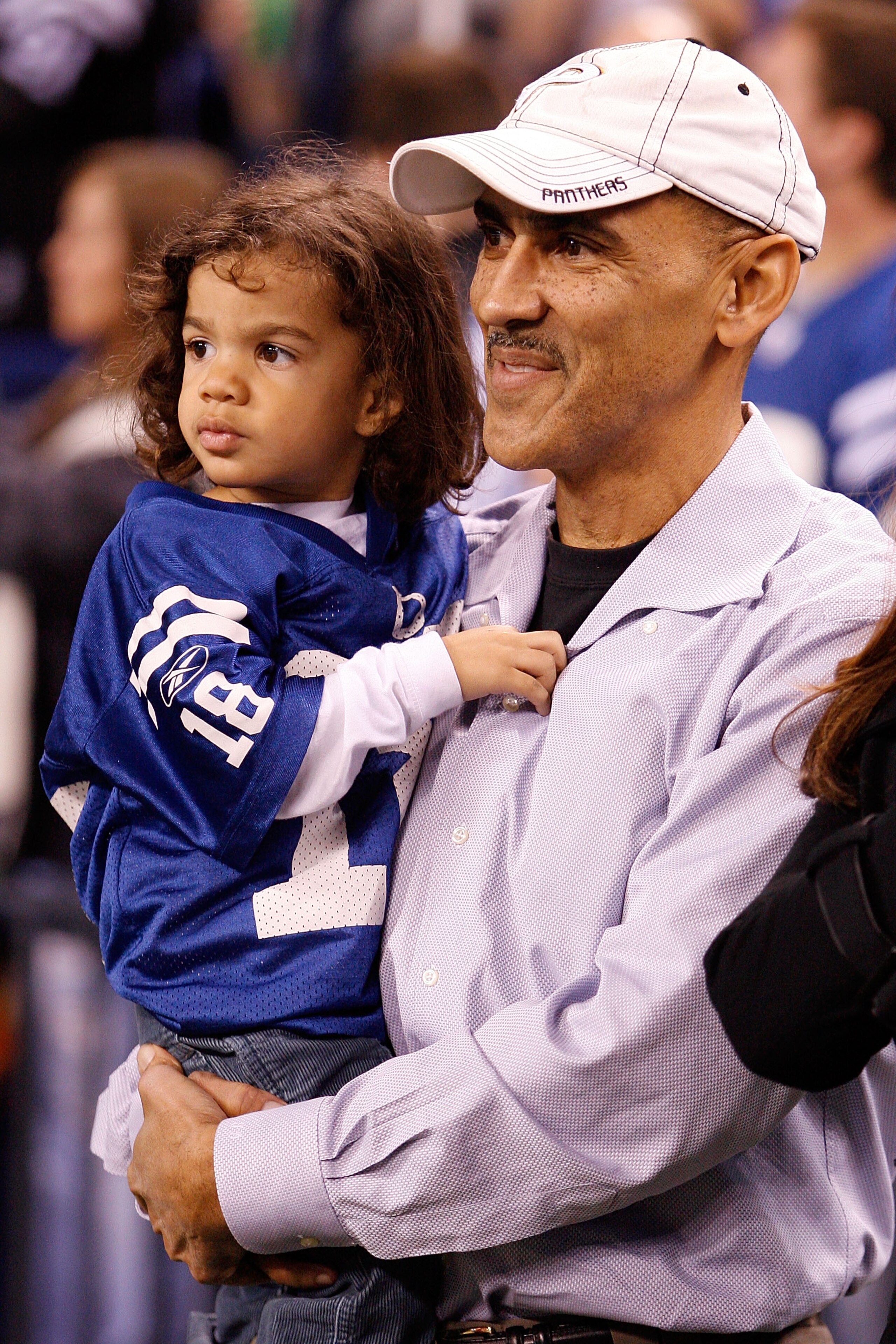 INDIANAPOLIS - JANUARY 16:  Former Indianapolis Colts head coach Tony Dungy and his child on the sideline before the Colts take on the Baltimore Ravens in the AFC Divisional Playoff Game at Lucas Oli Stadium on January 16, 2010 in Indianapolis, Indiana.